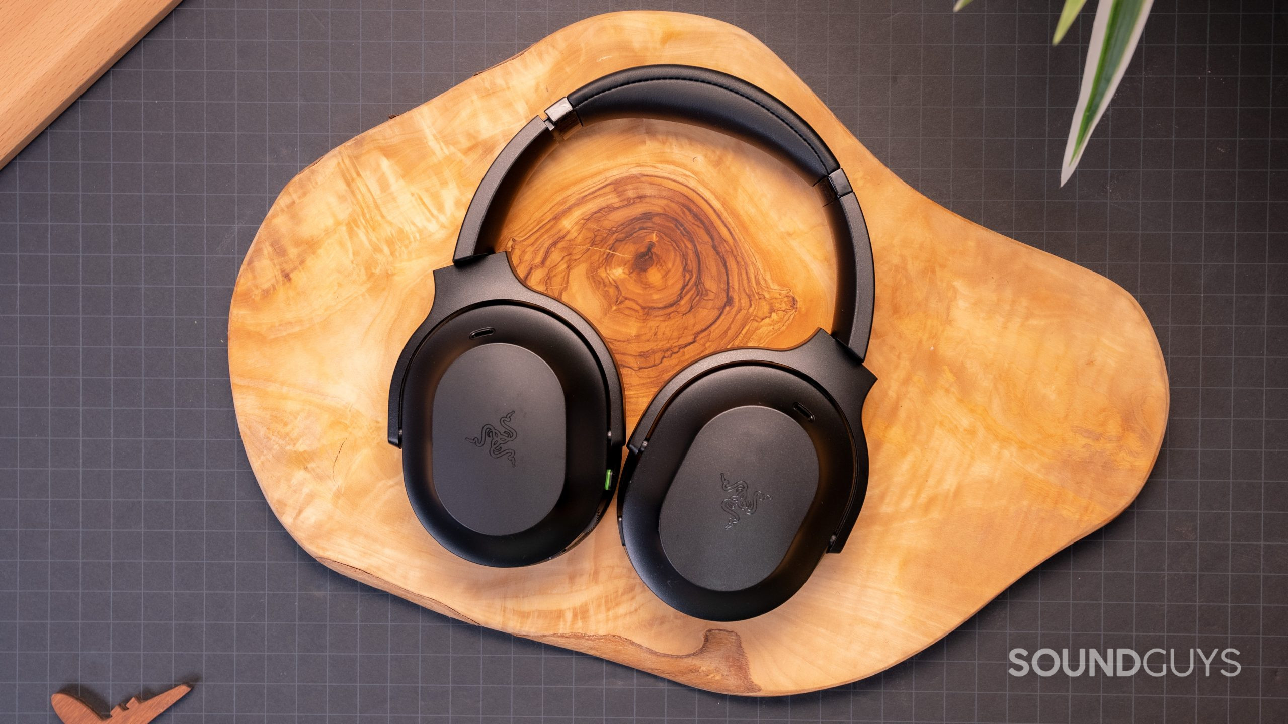 Razer Barracuda Pro distance tabletop The Razer Barracuda Pro placed on a wooden surface and viewed from a distance.