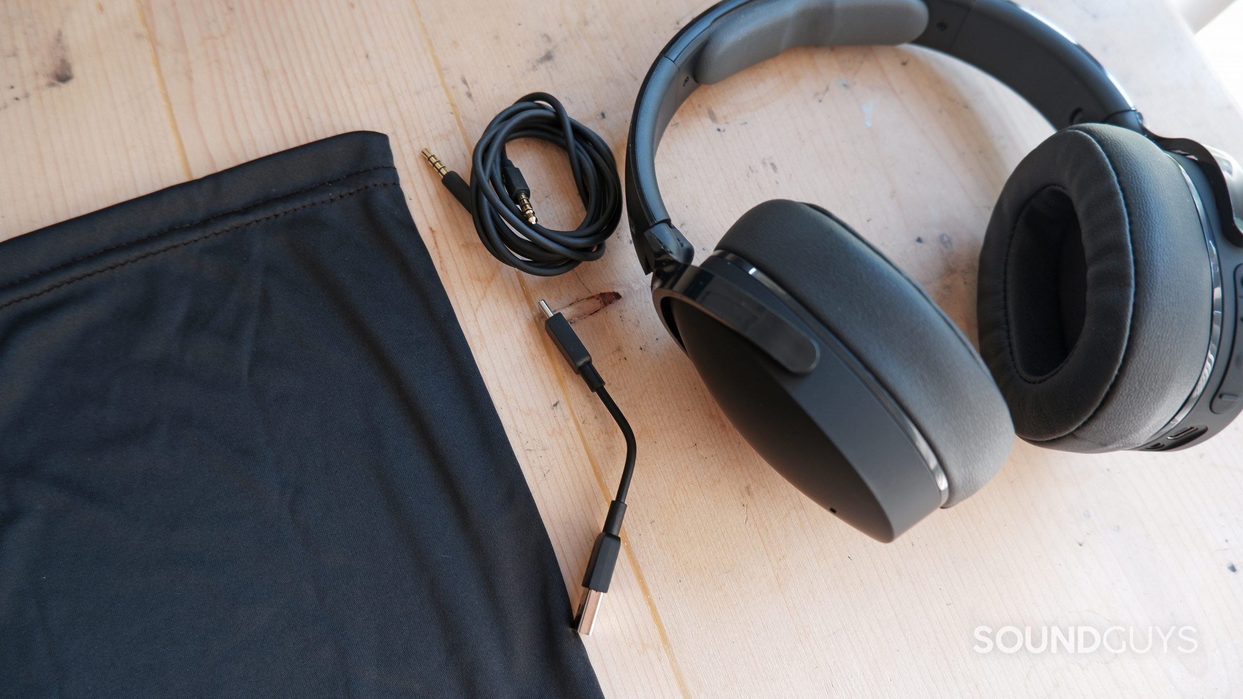 The Skullcandy Hesh ANC alongside the fabric case, 3.5mm cable, and USB-C charging cable.