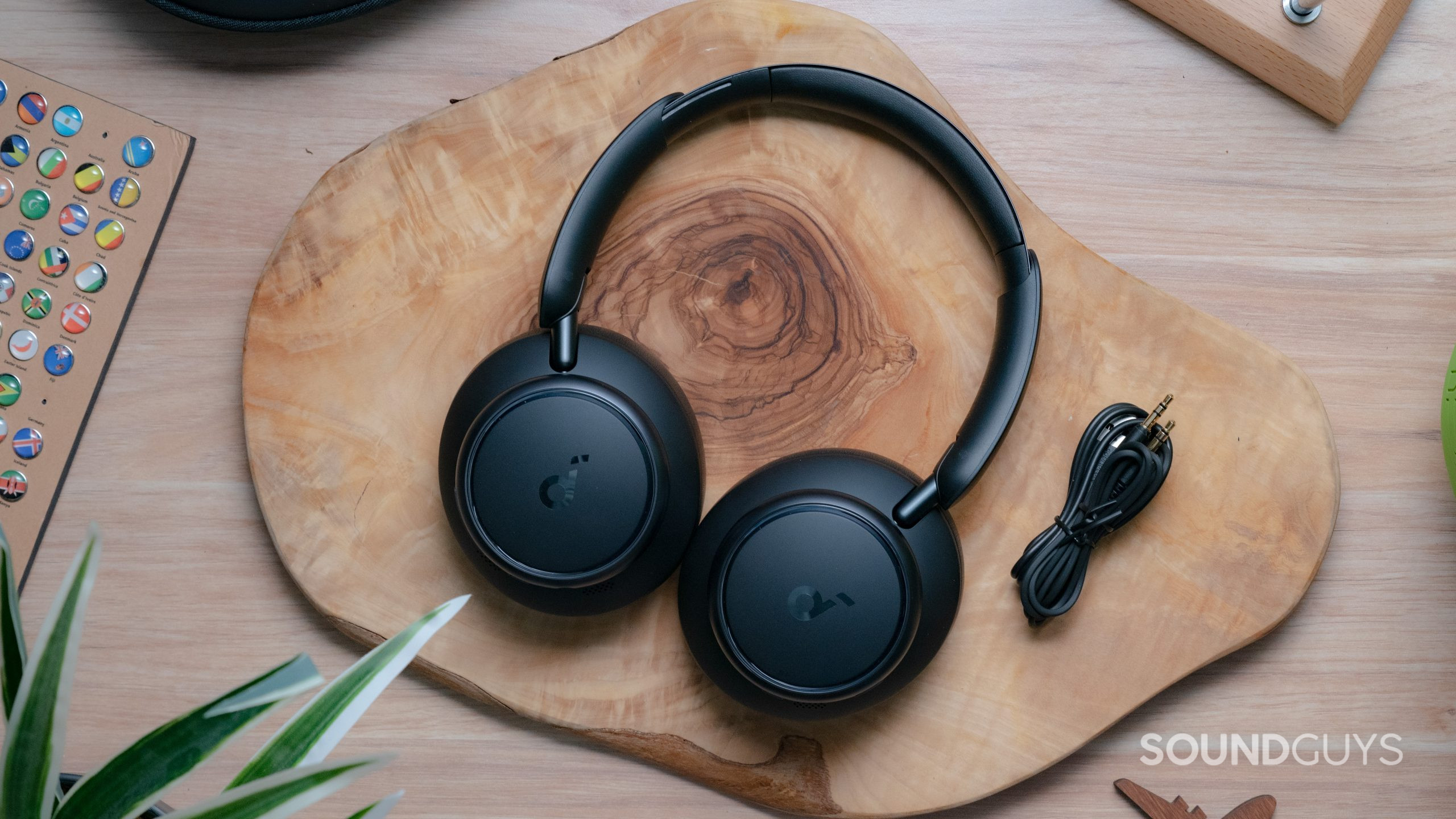 A view of the Anker Soundcore Space Q45 sitting on a wooden tabletop.