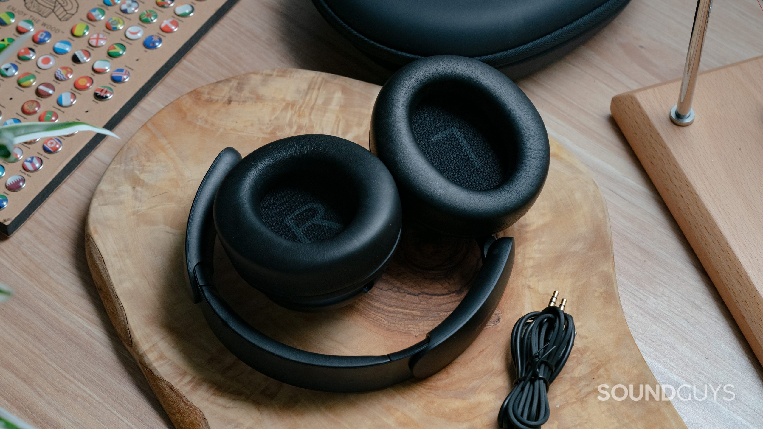 The Anker Soundcore Space Q45 sitting on a wooden table with the headset folded up.