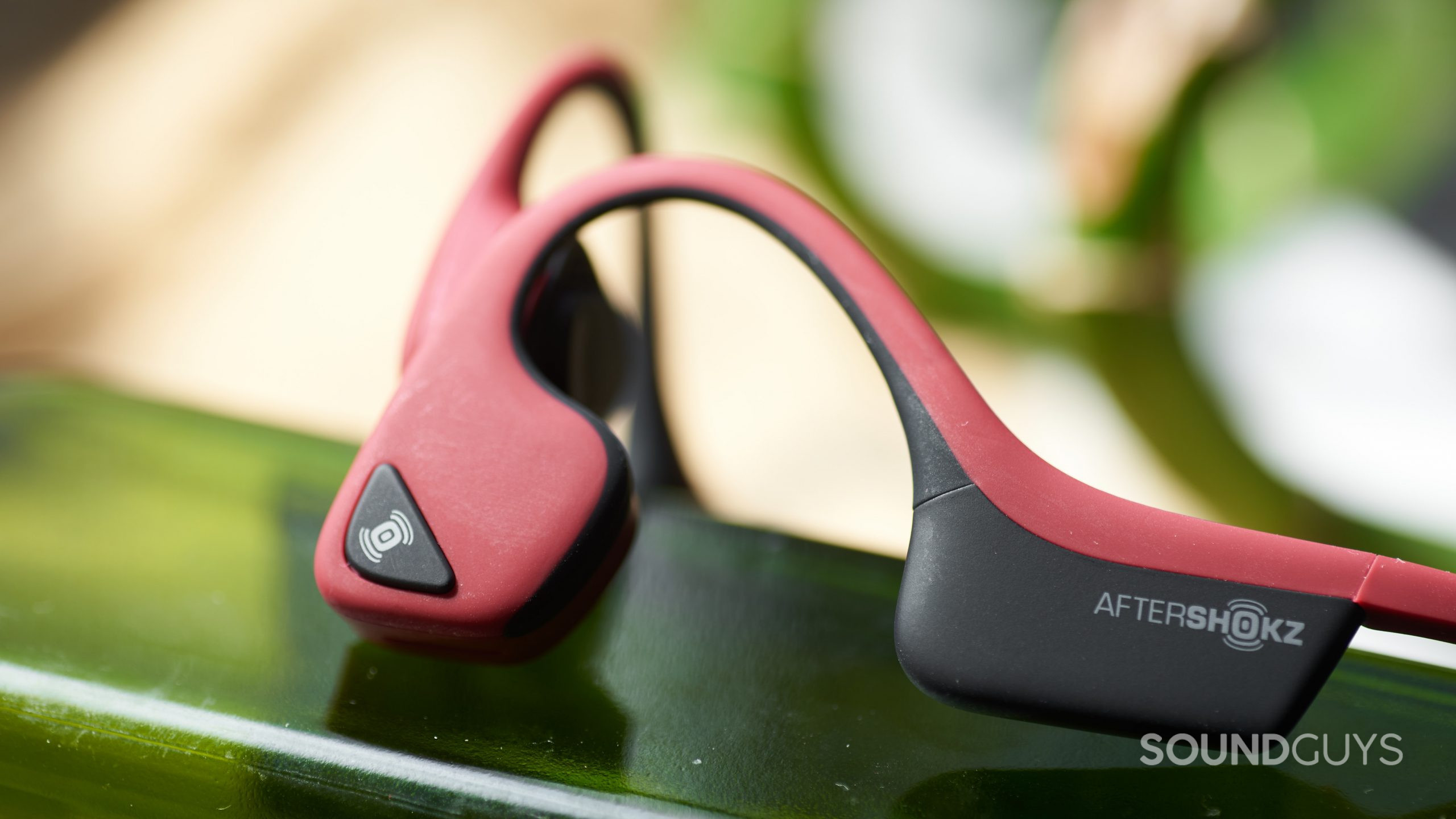 The AfterShokz Air bone conduction headphones' multi-function button.