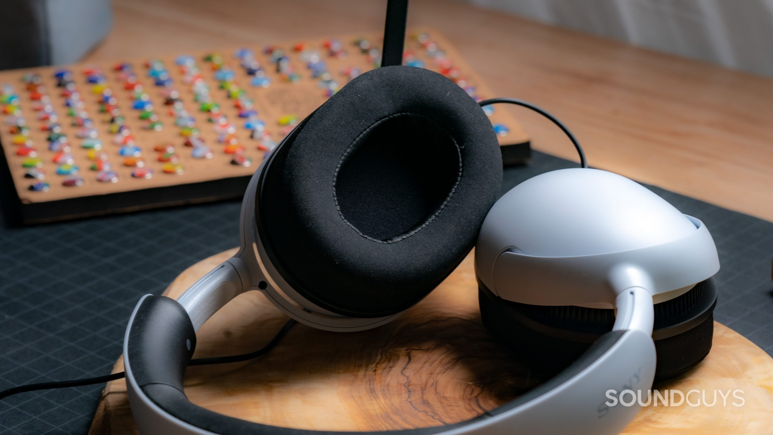 The Sony INZONE H3 sitting on a tabletop with one of the ear cups facing the viewer.