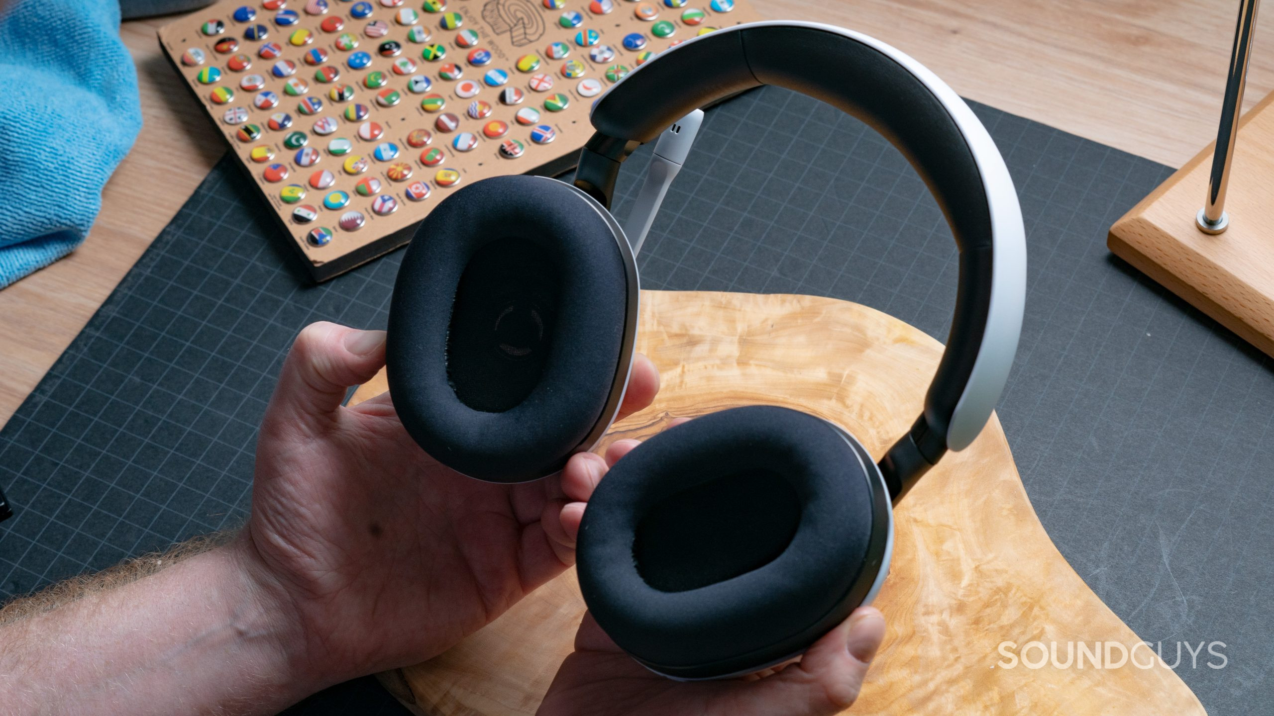 INZONE_H7 in the hand Someone holds the Sony INZONE H7 gaming headset, with the earcups facing up.