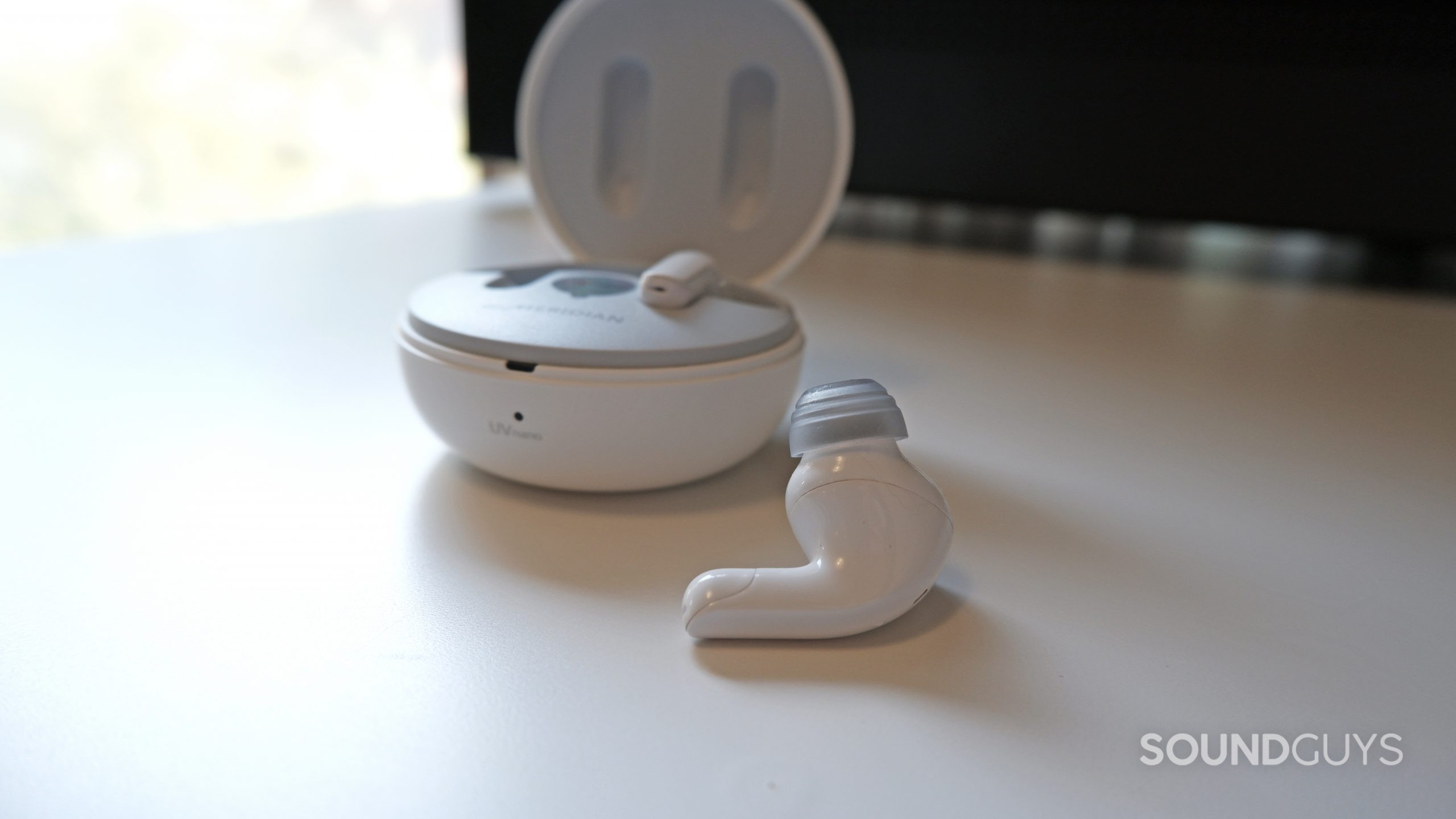 One earbud of the LG TONE Free T90 outside of the case.