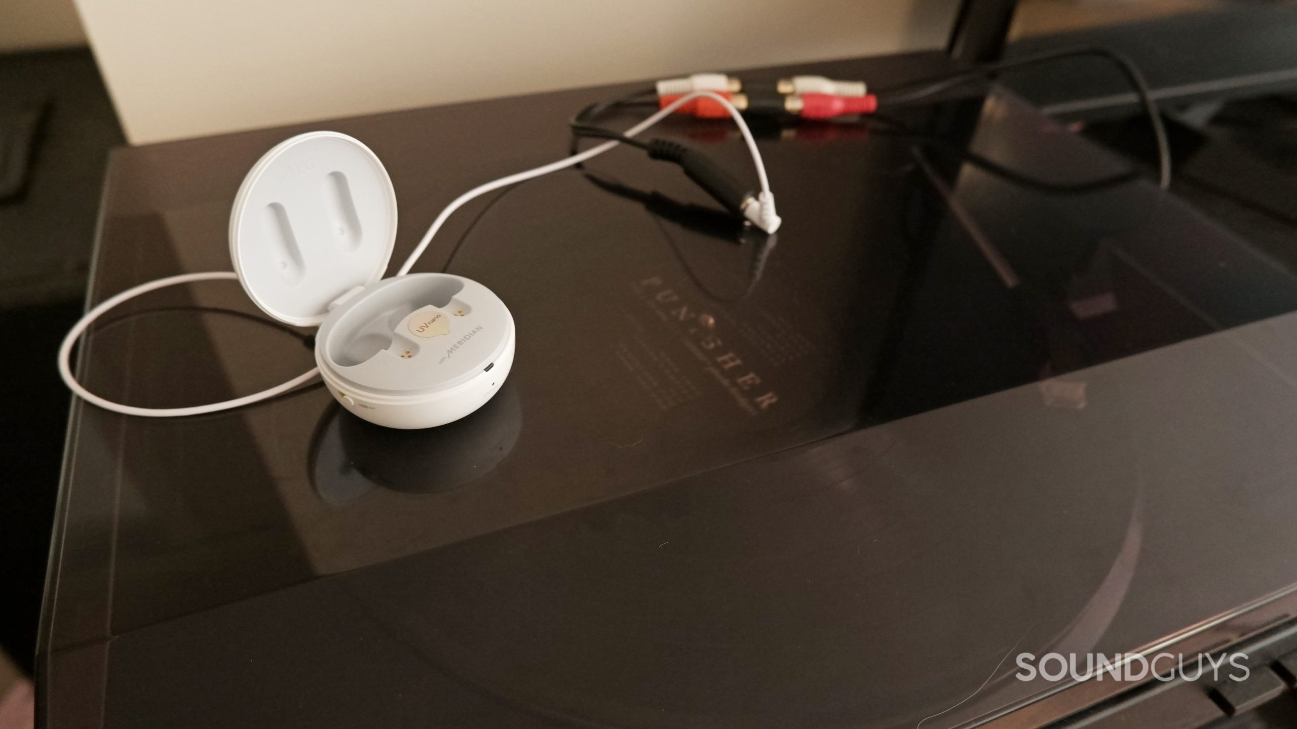 The LG TONE Free T90 plugged into a record player.