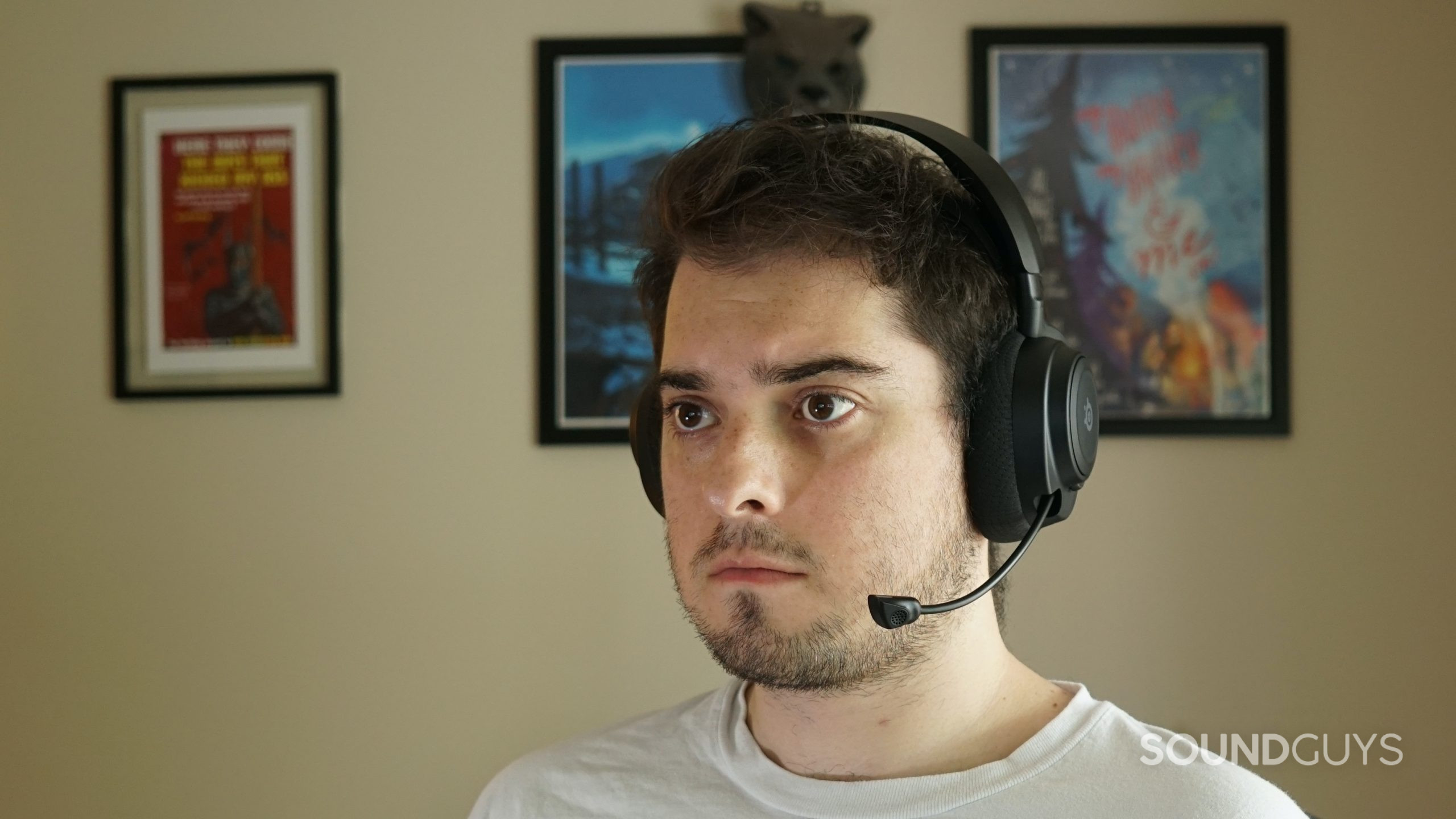 A man wears the SteelSeries Arctis Nova 7 gaming headset.
