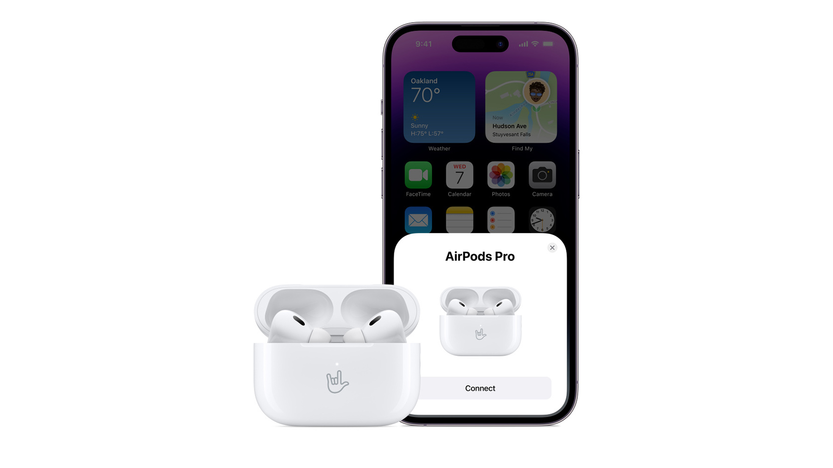 The Apple AirPods Pro (2nd generation) with the engraved case standing in front of an iPhone 14.
