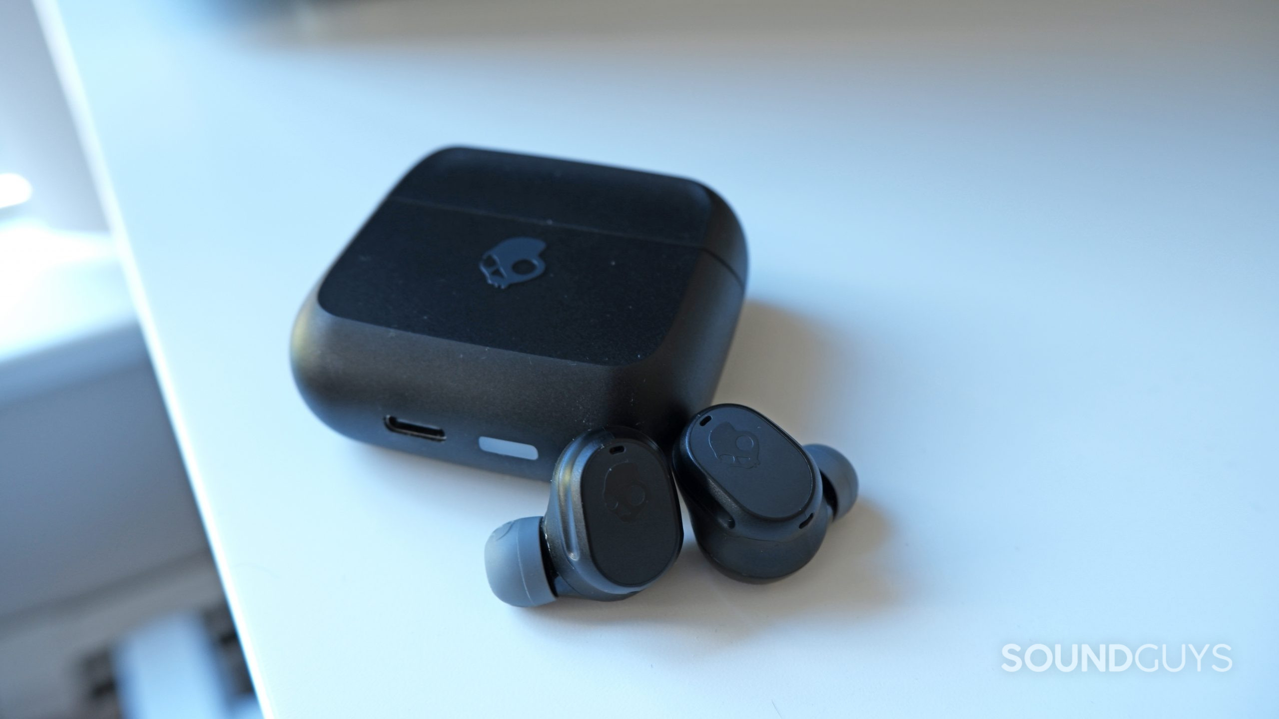 The Skullcandy Mod XT earbuds beside the case.