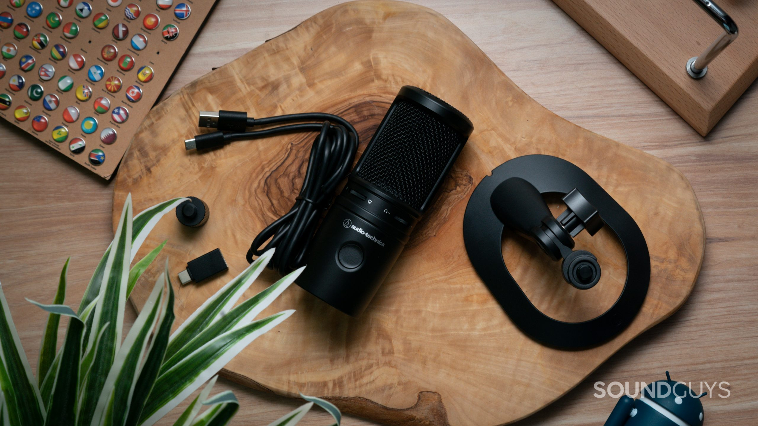 An overhead view of the AT2020USB-X on a wooden table with the included accessories.