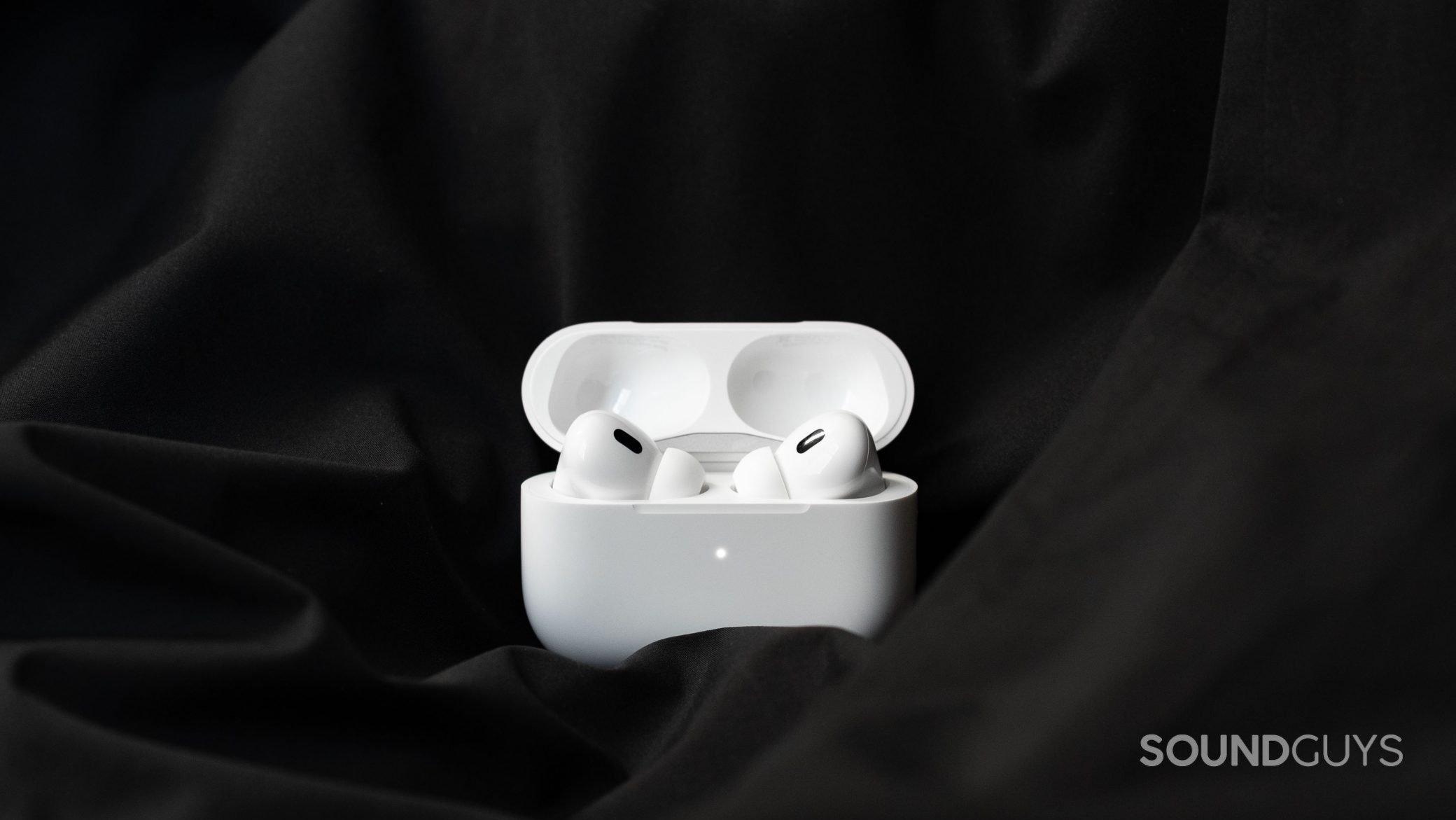 The Apple AirPods Pro (2nd generation) case is open to reveal the noise canceling wireless earbuds inside.