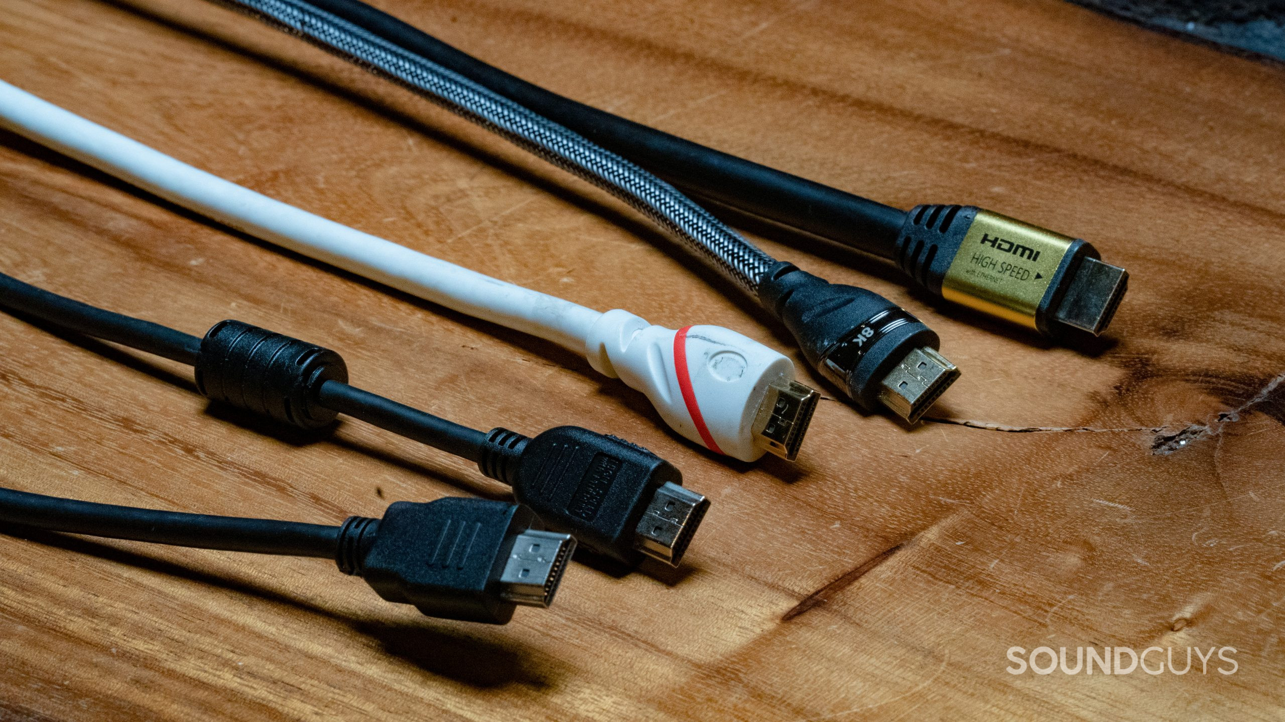 An assortment of 5 different HDMI cables showing the connector at the end of each.