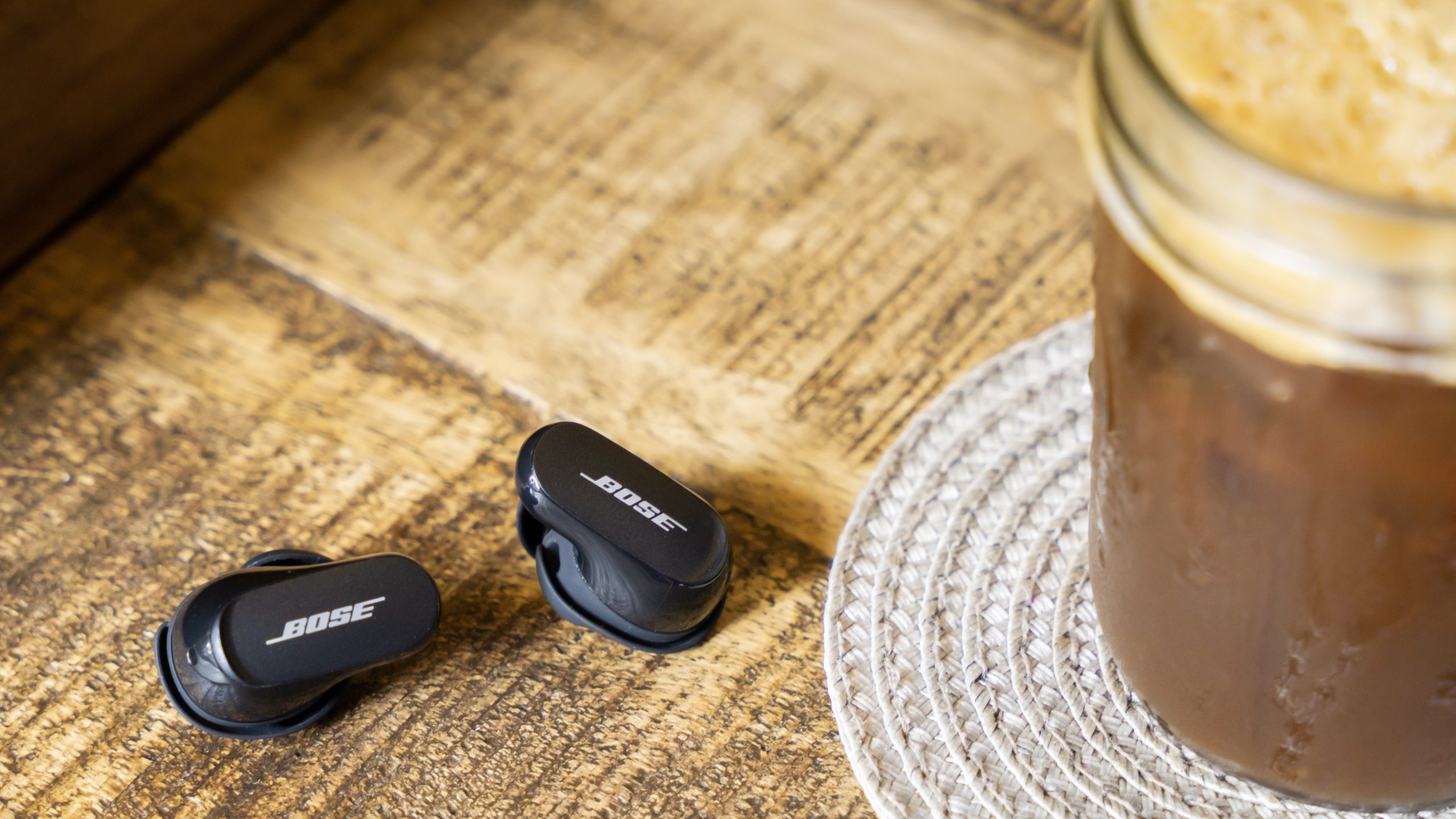 Pair of Bose QuietComfort Earbuds II on a table