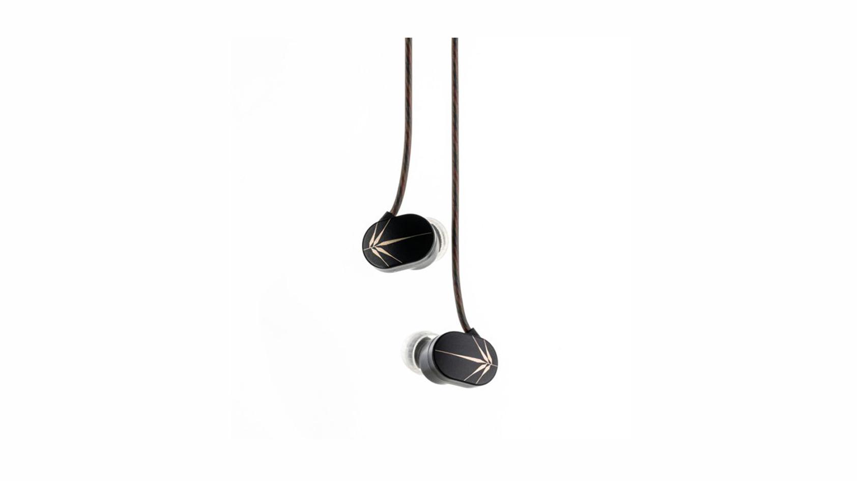 A pair of Moondrop Chu earbuds dangle in front of a blank background.