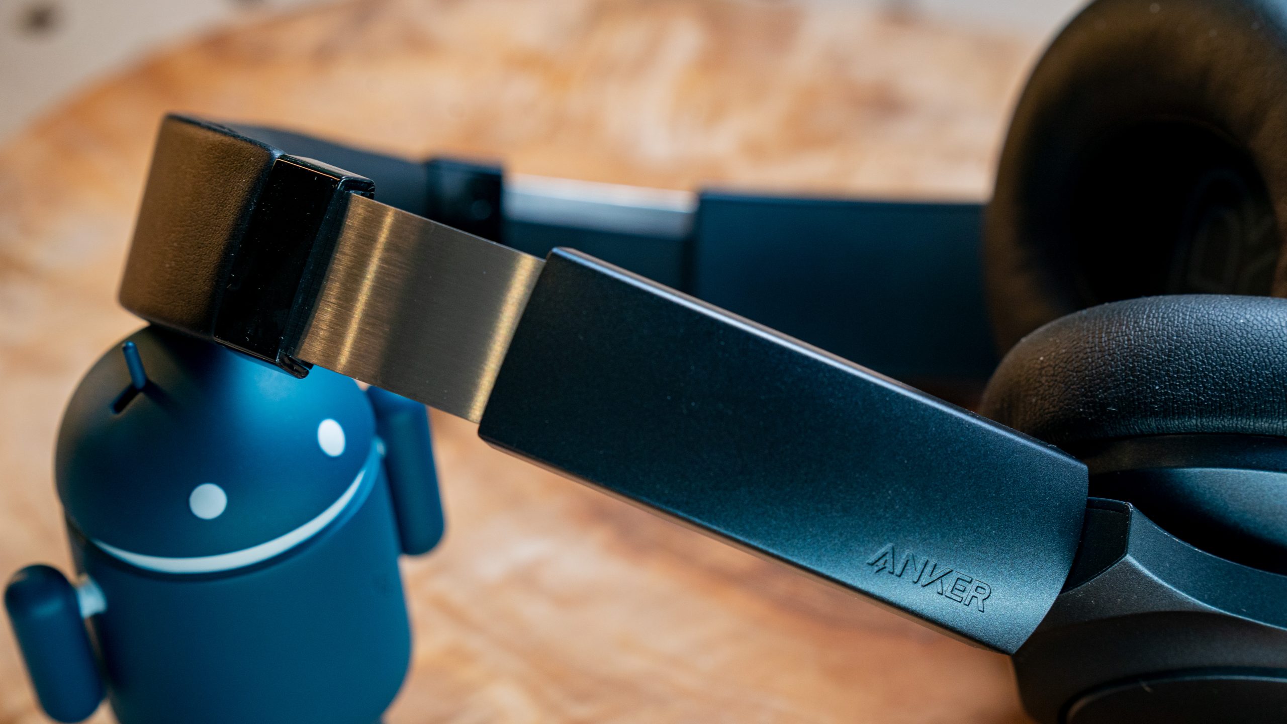 The Anker Soundcore Life Q20 headband stretched out on an Android figurine.