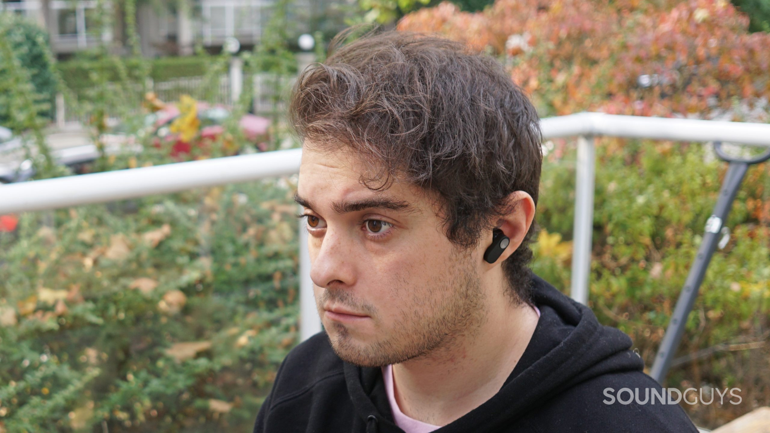 OnePlus-Nord-Buds-headshot A man wears the OnePlus Nord Buds outside.