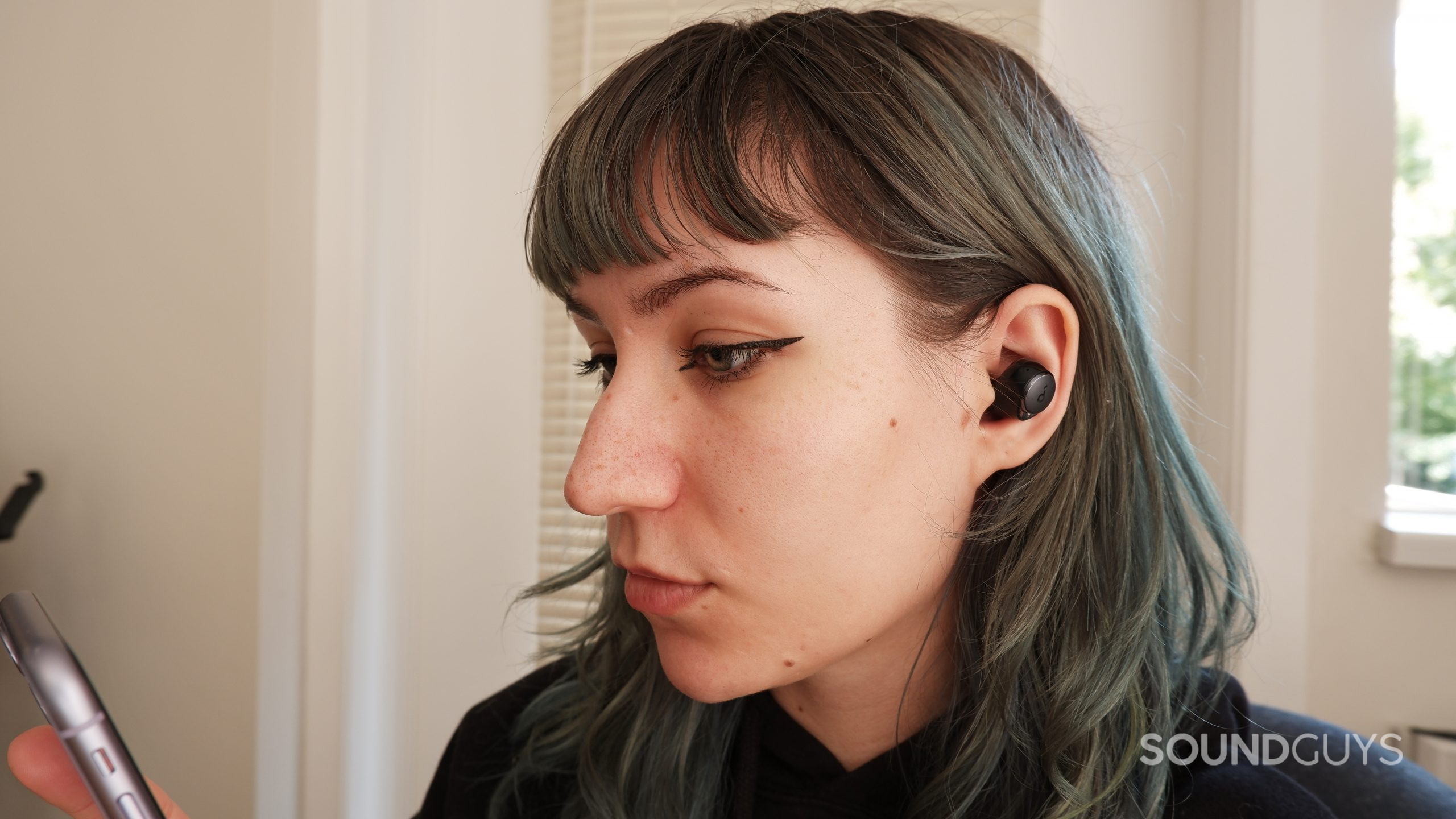 The Anker Soundcore Space A40 in a person's ears.