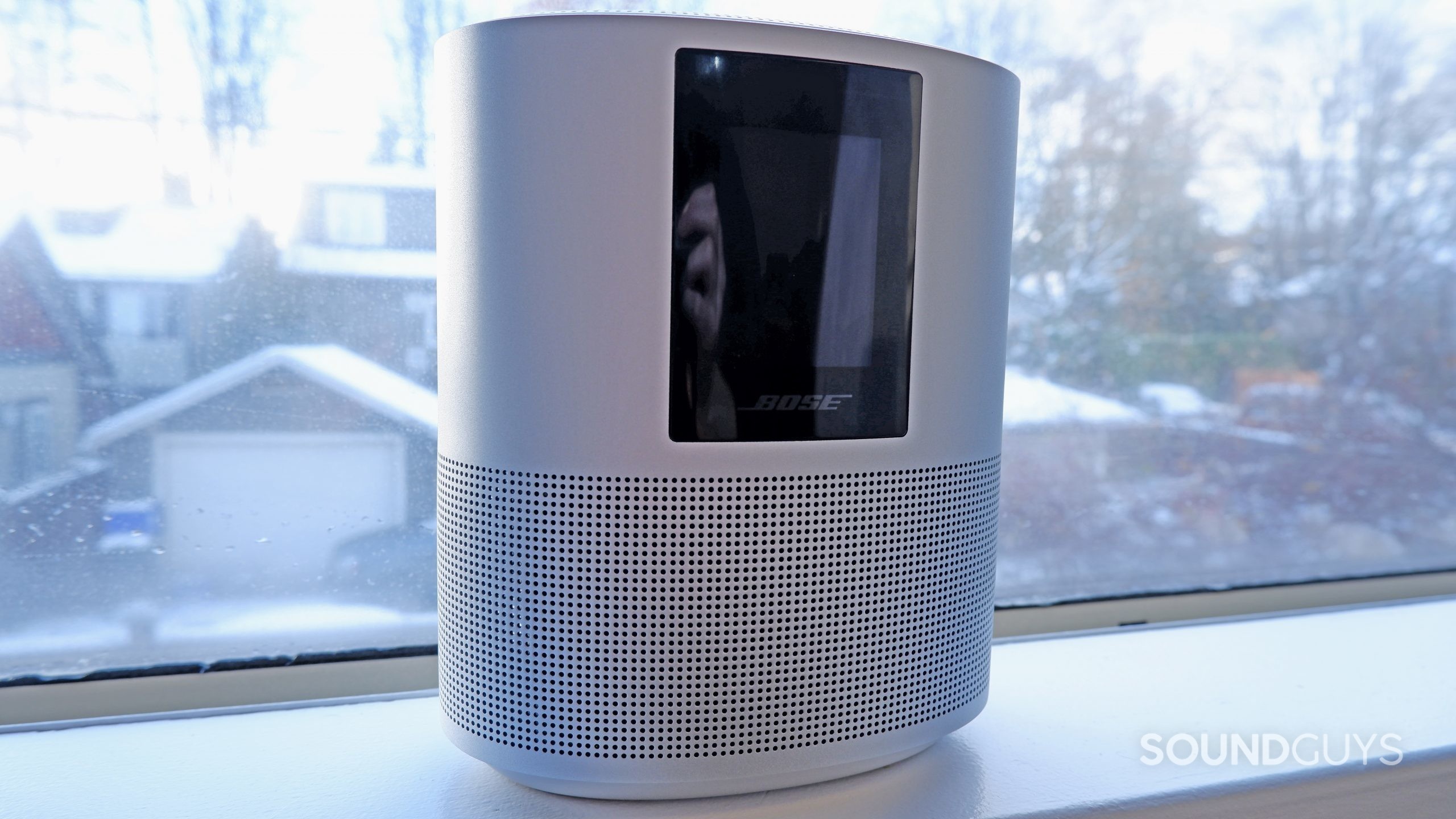 The Bose Home Speaker 500 in front of a window.