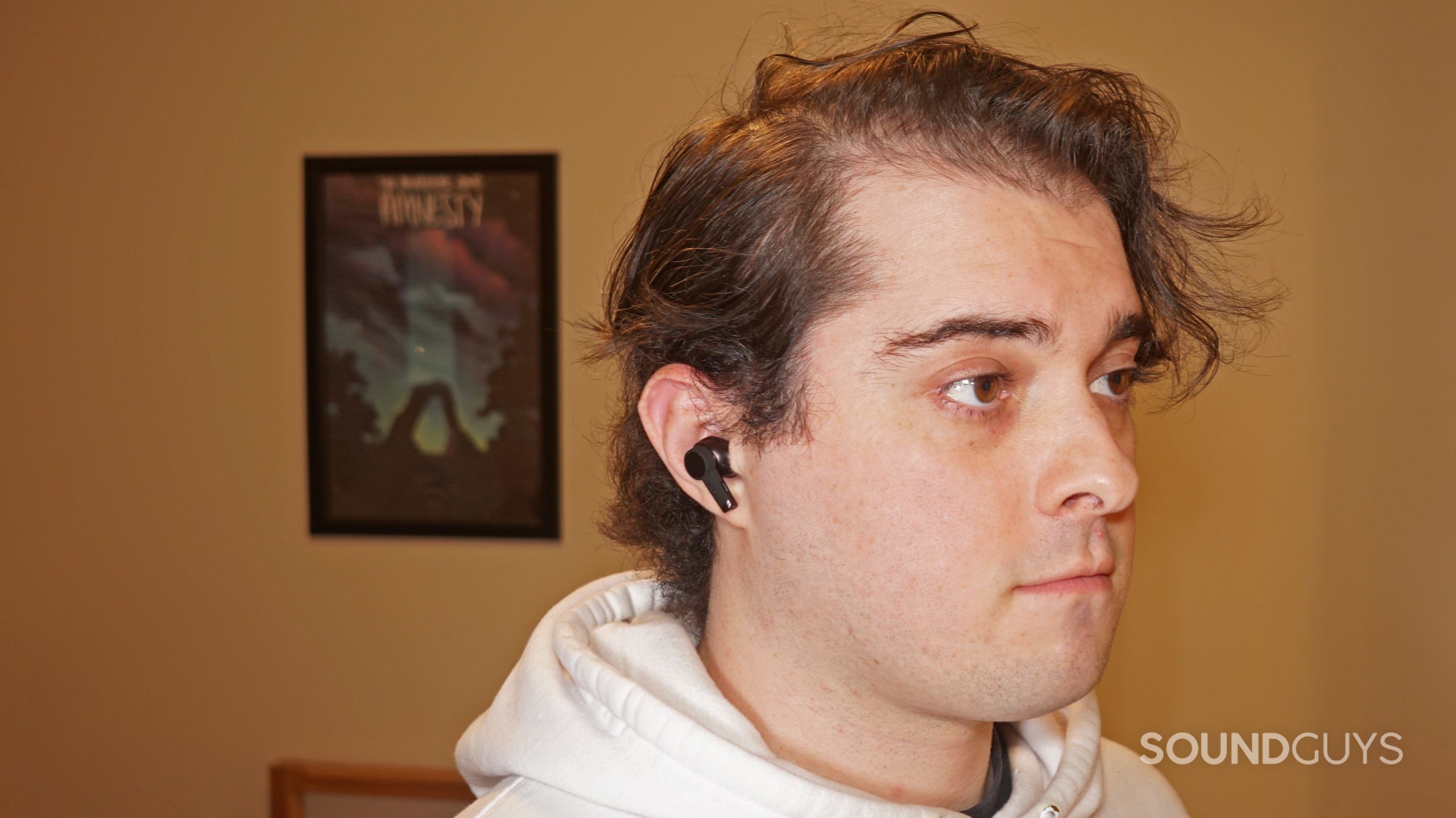 A man wears the Audio-Technica ATH-TWX9 earbuds.