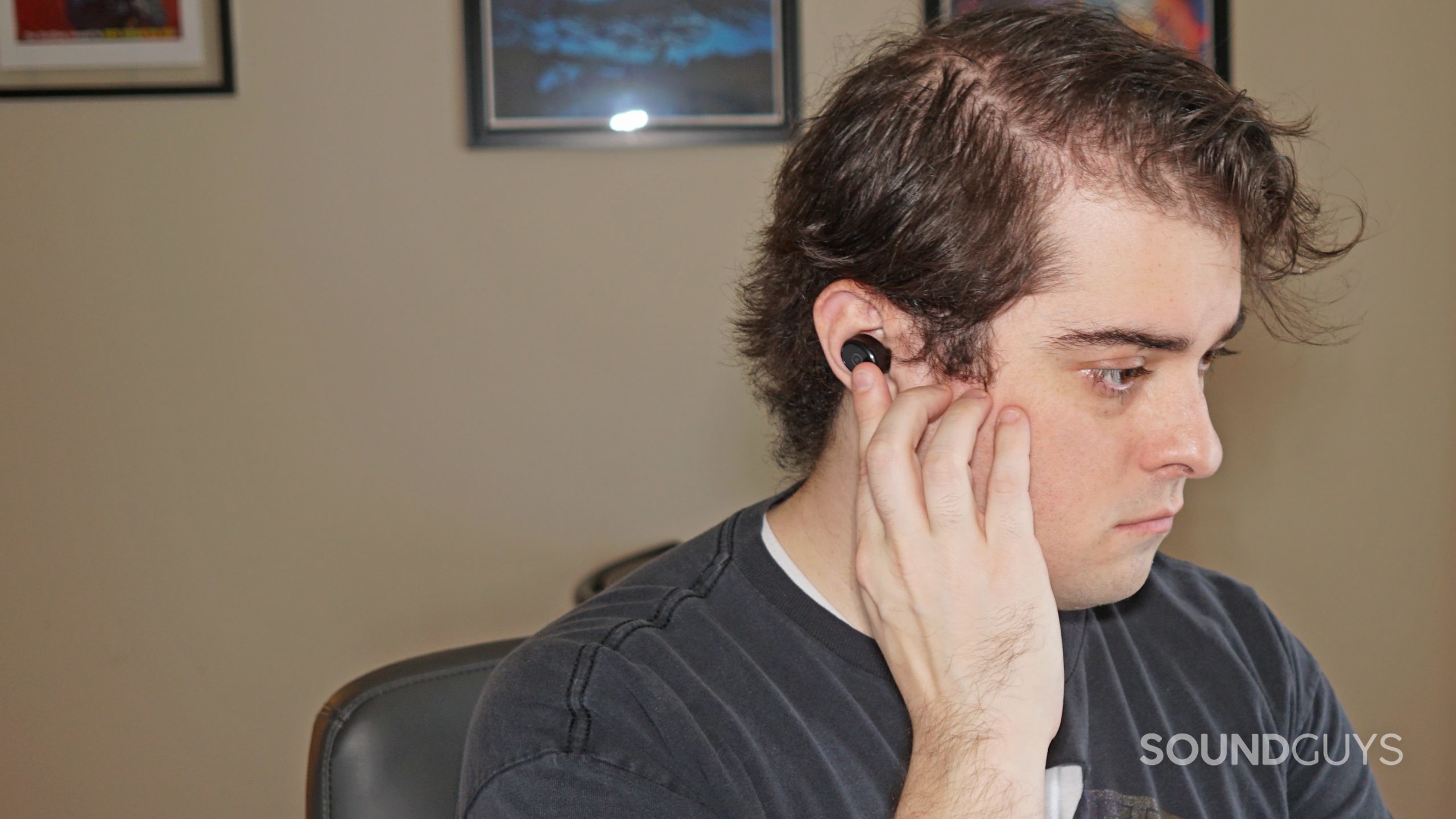 TOZO-T10-headshot A man wears the TOZO T10, tapping the touch controls