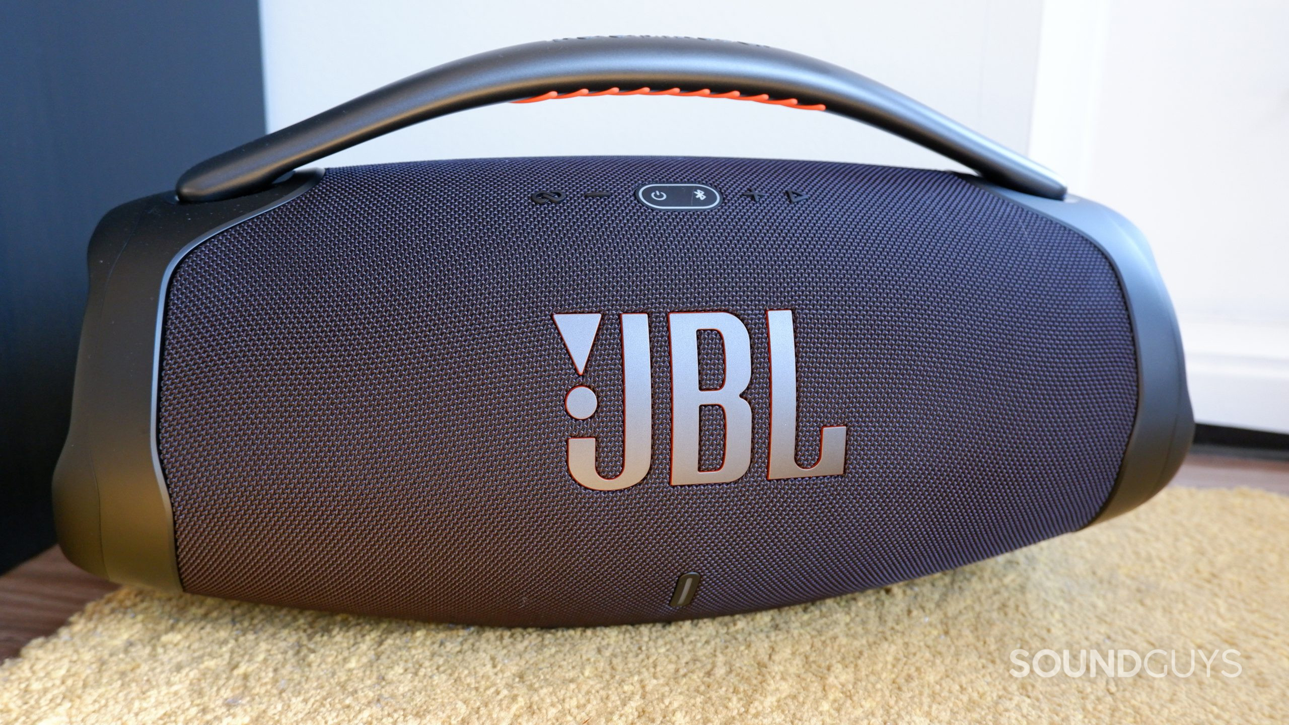 The JBL Boombox 3 on a carpet.