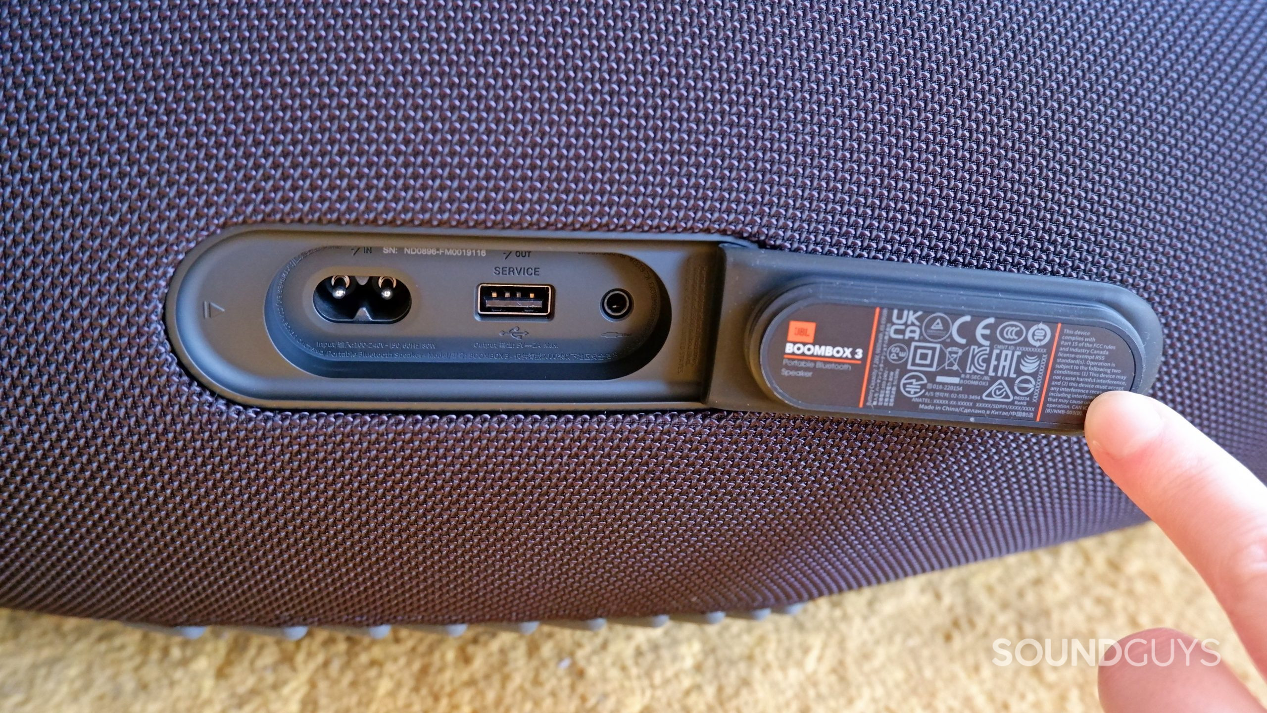 The ports on the back of the JBL Boombox 3, with the power port on the left, the USB-A service port in the middle, and the 3.5mm port on the right.