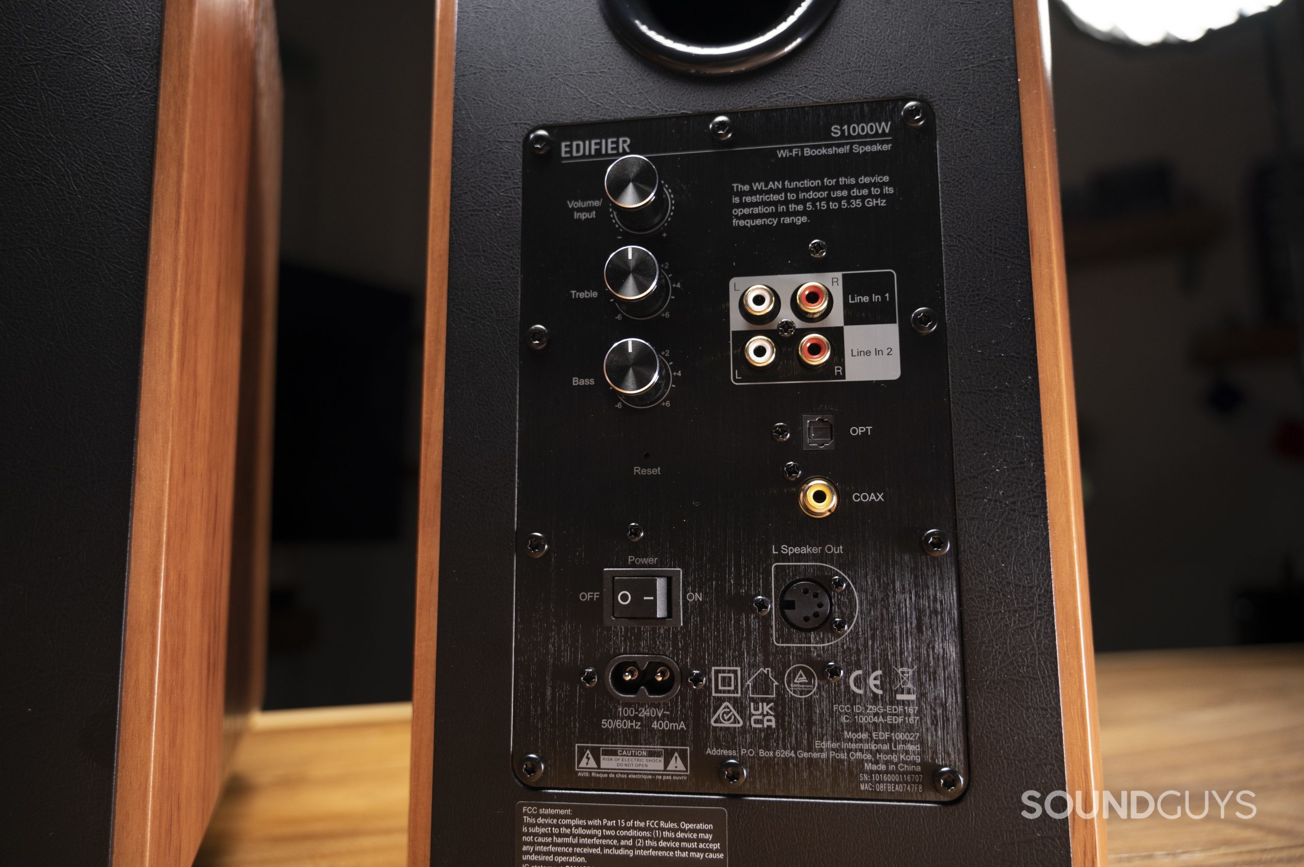 The back of the right Edifier S1000W speaker shows the inputs and ports.