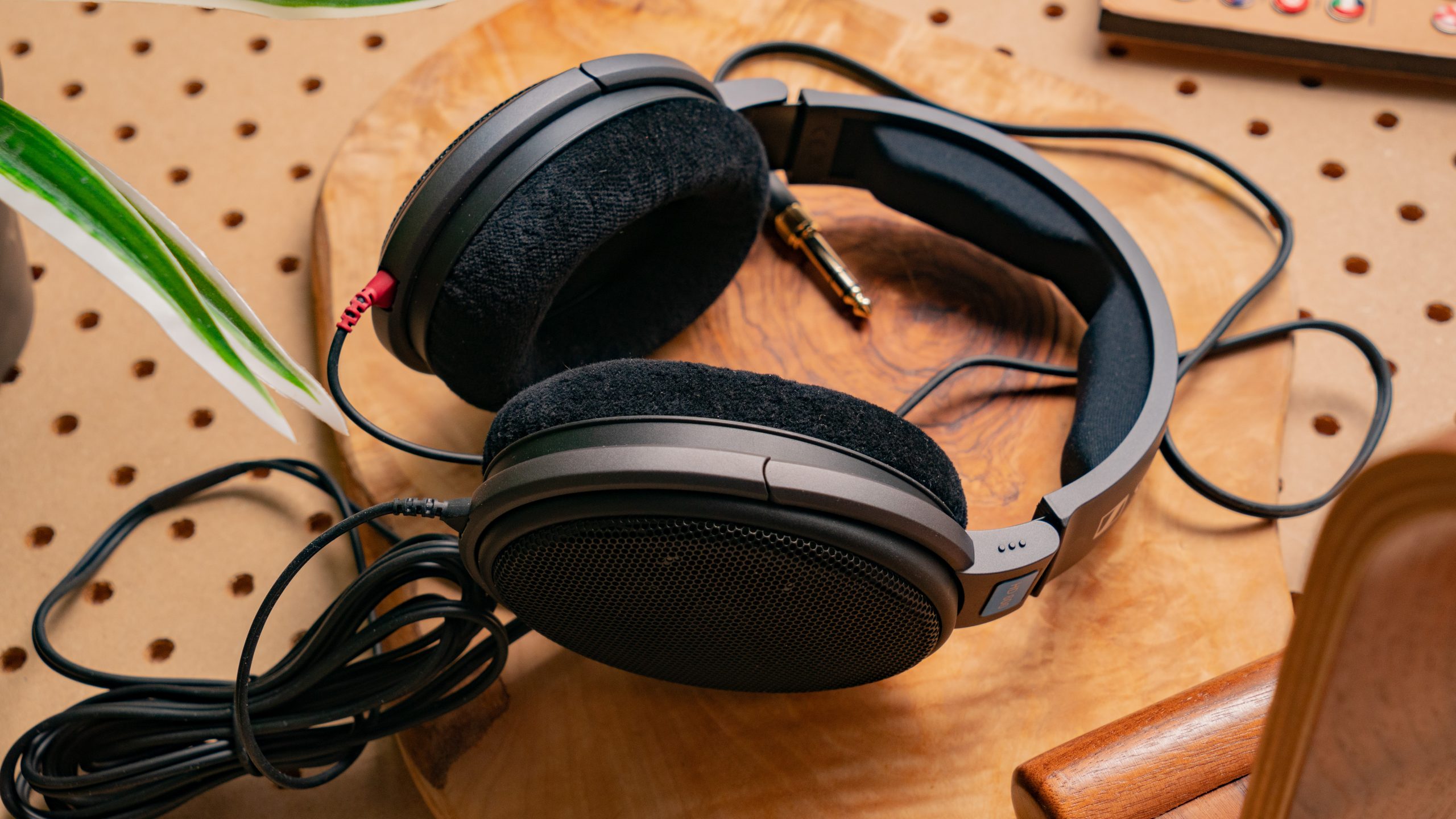 The Sennheiser HD 600 headphones on a wood table. 