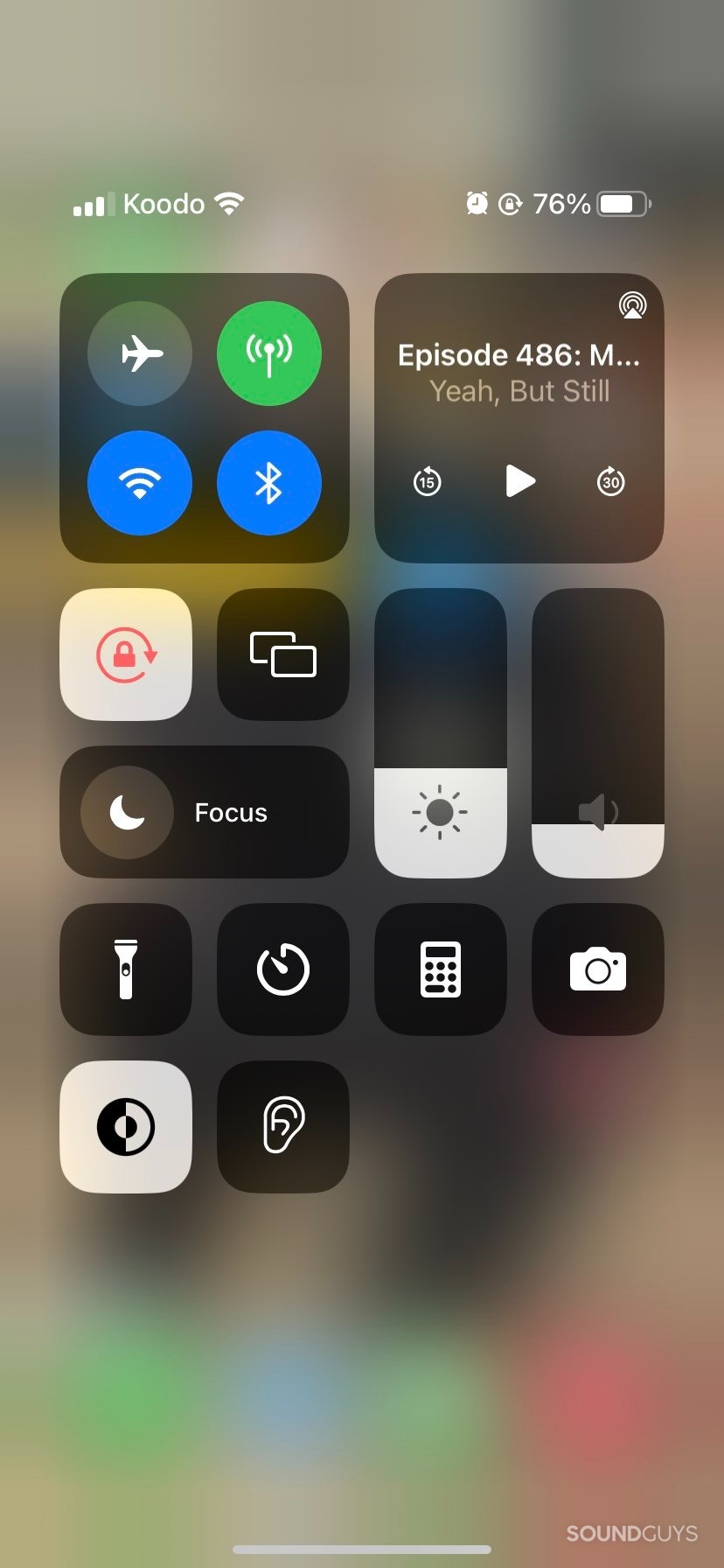 The Control Center on an iPhone, showing an ear icon for hearing accessibility settings.