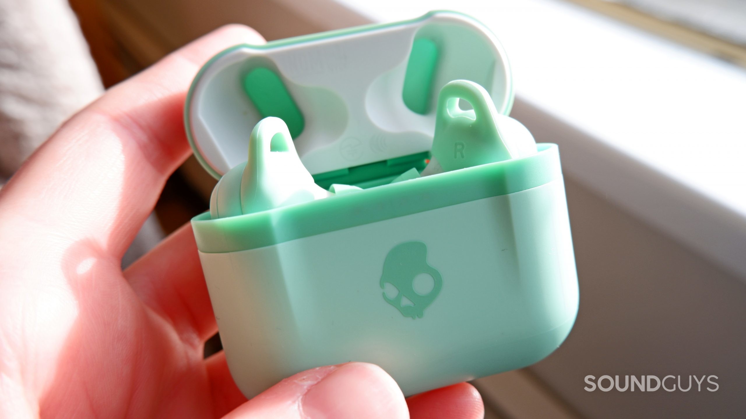 The Skullcandy Indy Evo earbuds inside of the case.