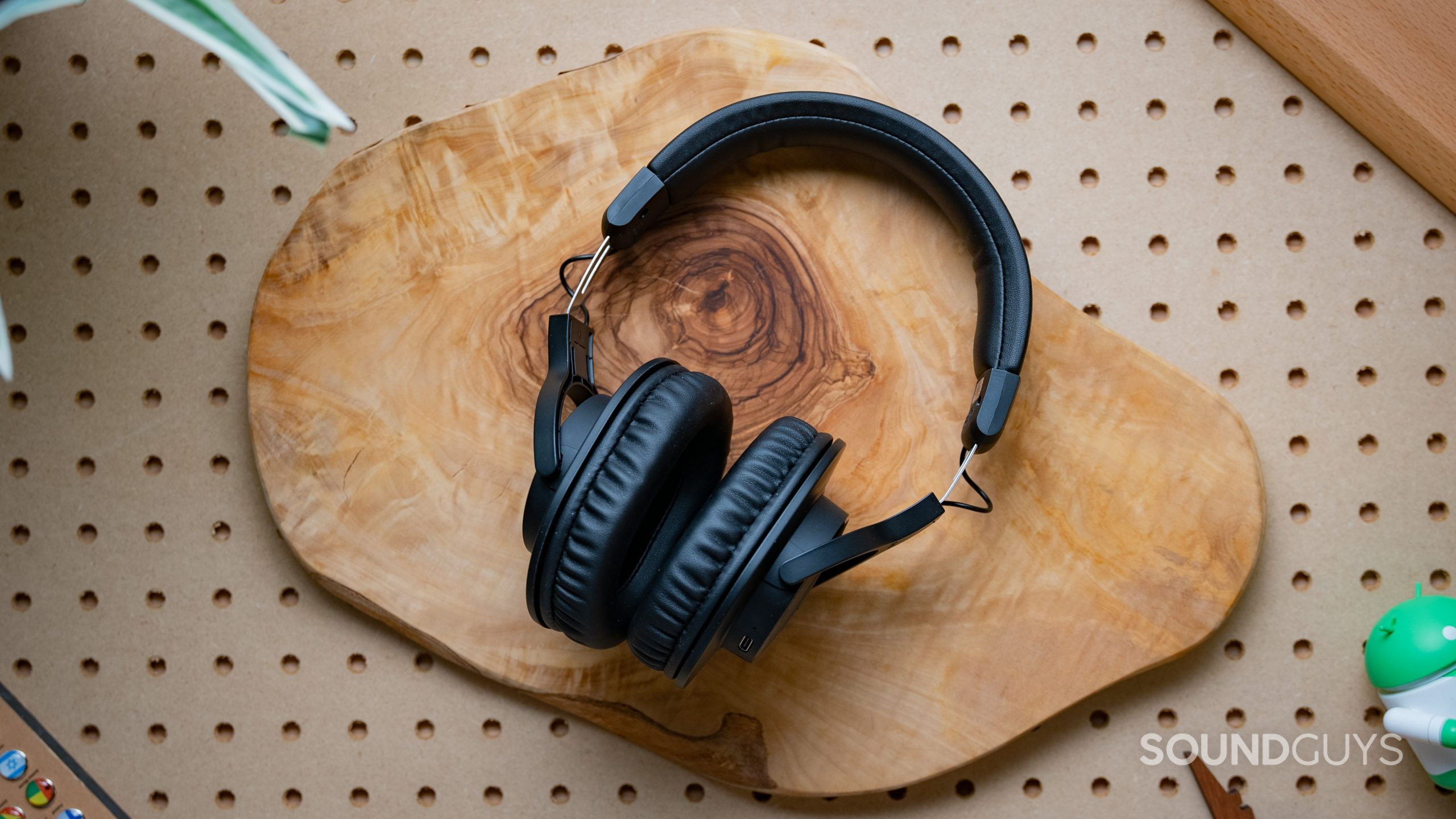 The Audio-Technica ATH-M20xBT headphones shot from above resting on a wood surface.