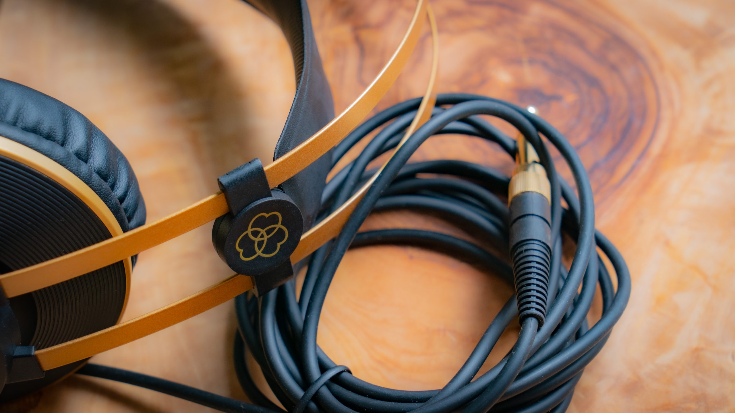 A photo of the AKG K92's cable, wound and resting on a table.
