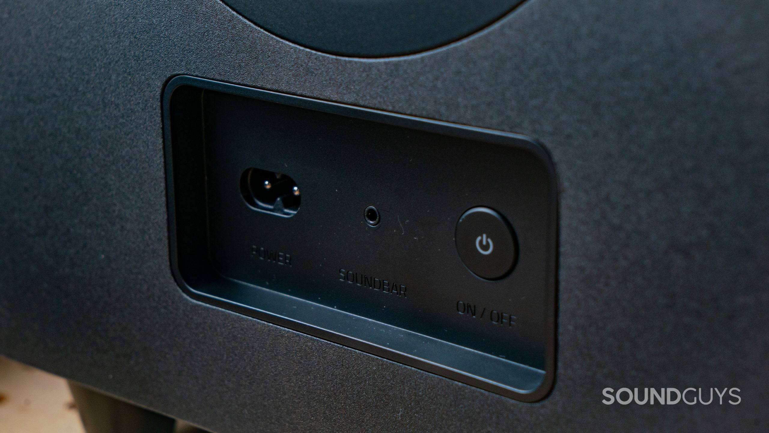 A detail shot of the Razer Leviathan V2 Pro subwoofer power button and port.