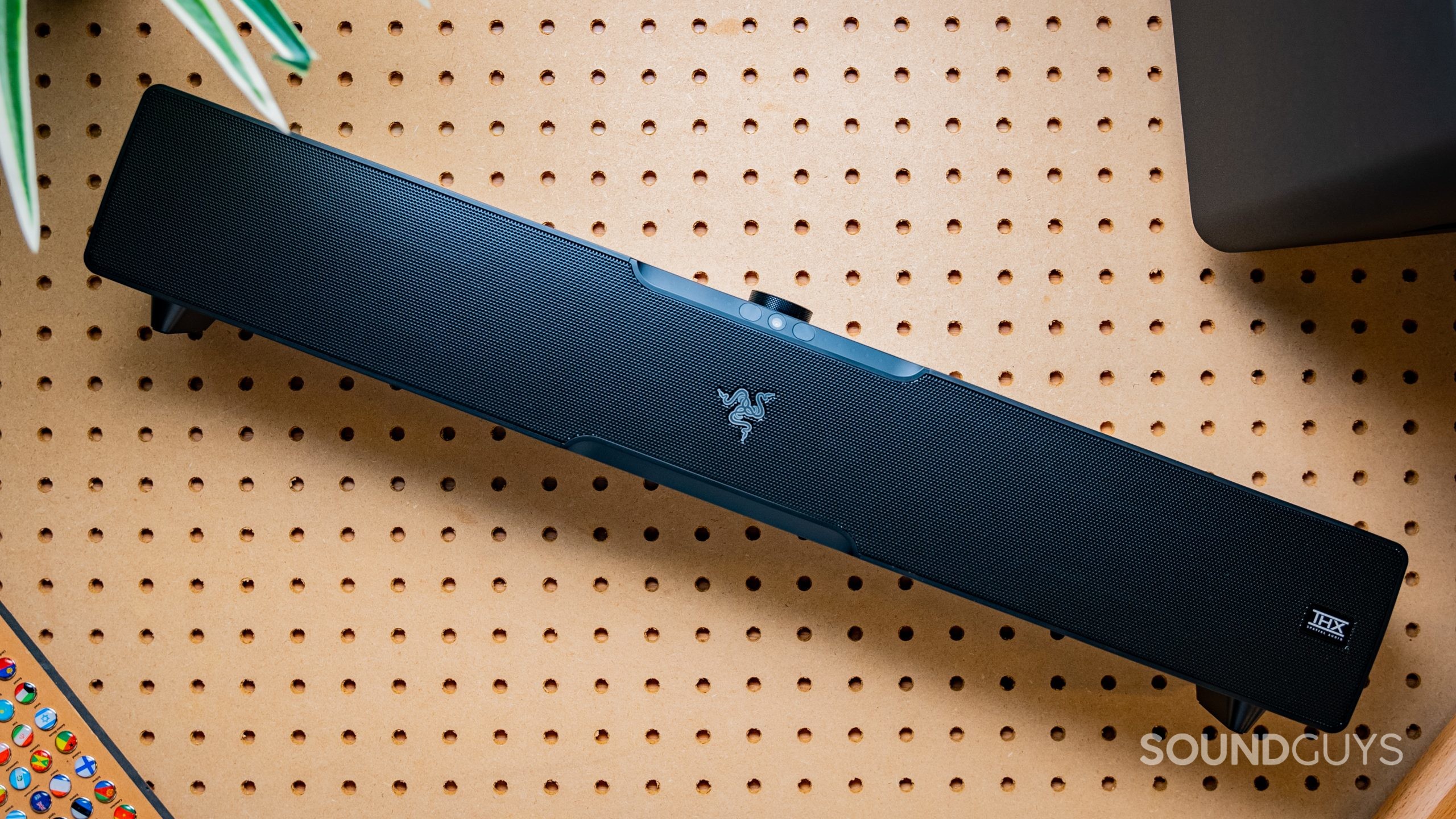 The Razer Leviathan V2 Pro lays on a peg board.