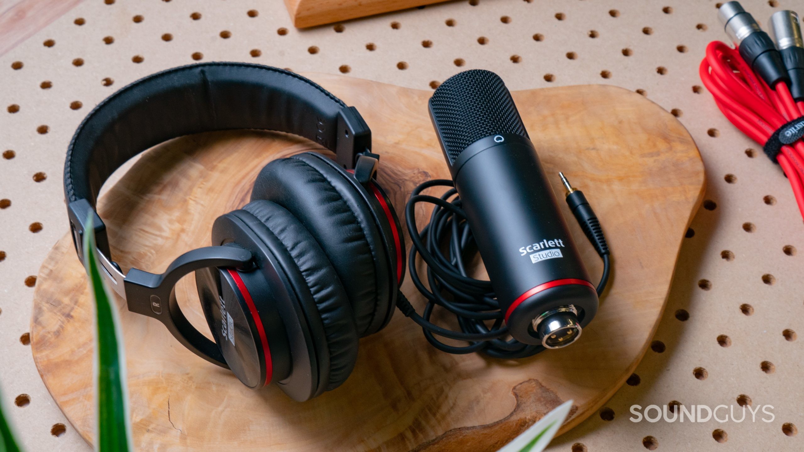 The Focusrite Scarlett HP60 MkIII and CM 25 MkIII lay next to each other on a wooden surface.