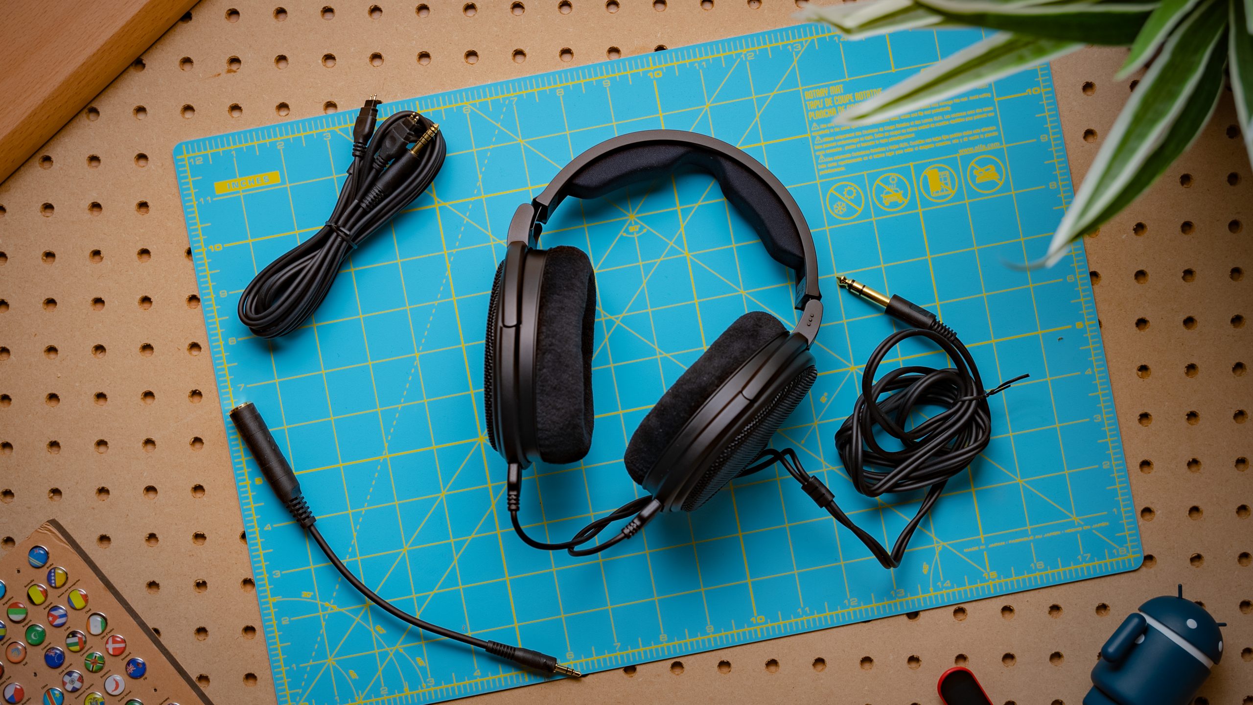 A photo of the Sennheiser HD 660S2 sitting atop a cyan sheet.