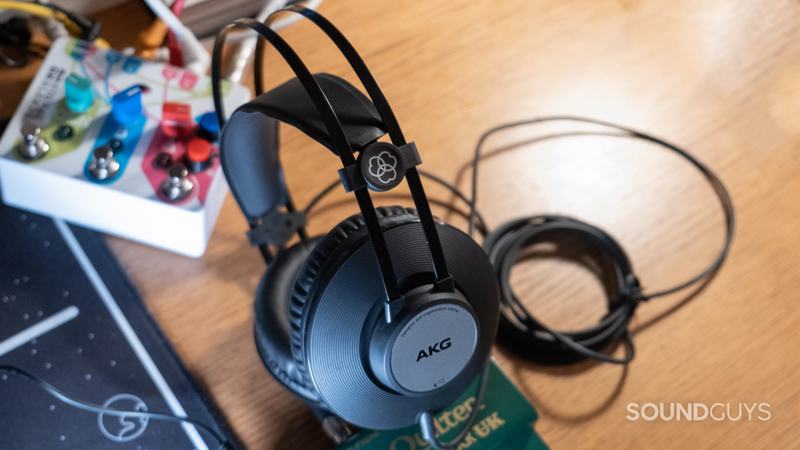 The AKG K72 centered with music gear and the long cable shown.