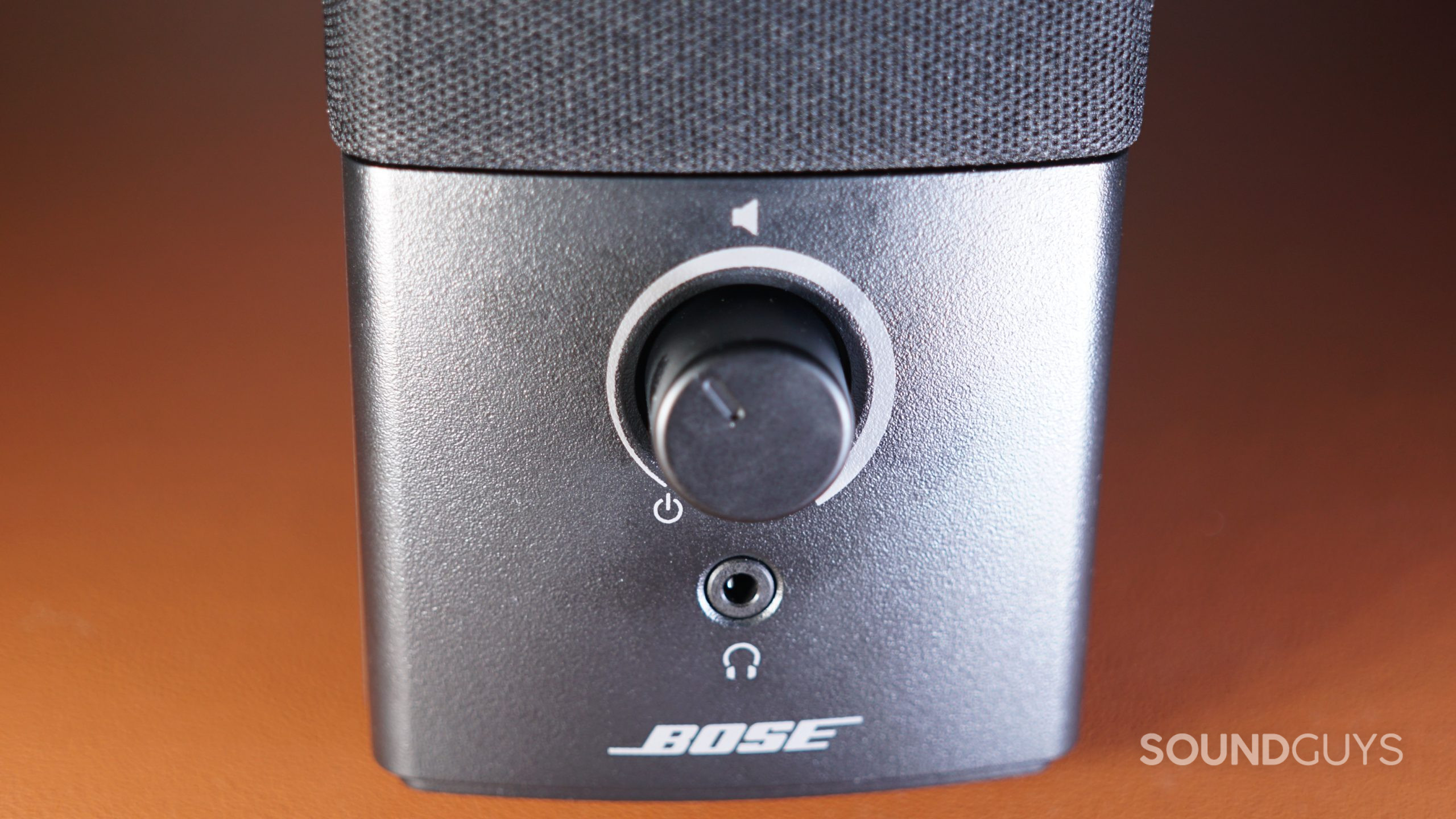 A close-up of the front controls of the Bose Companion 2 Series III speaker.