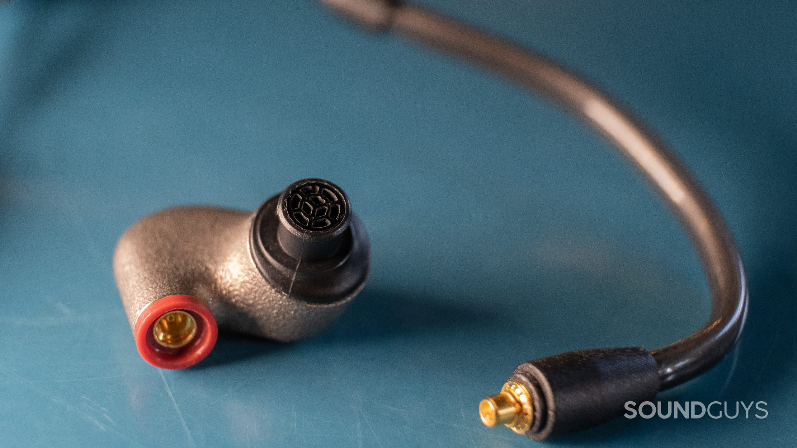 A close up shows the Sennheiser IE 600 MMCX connection.