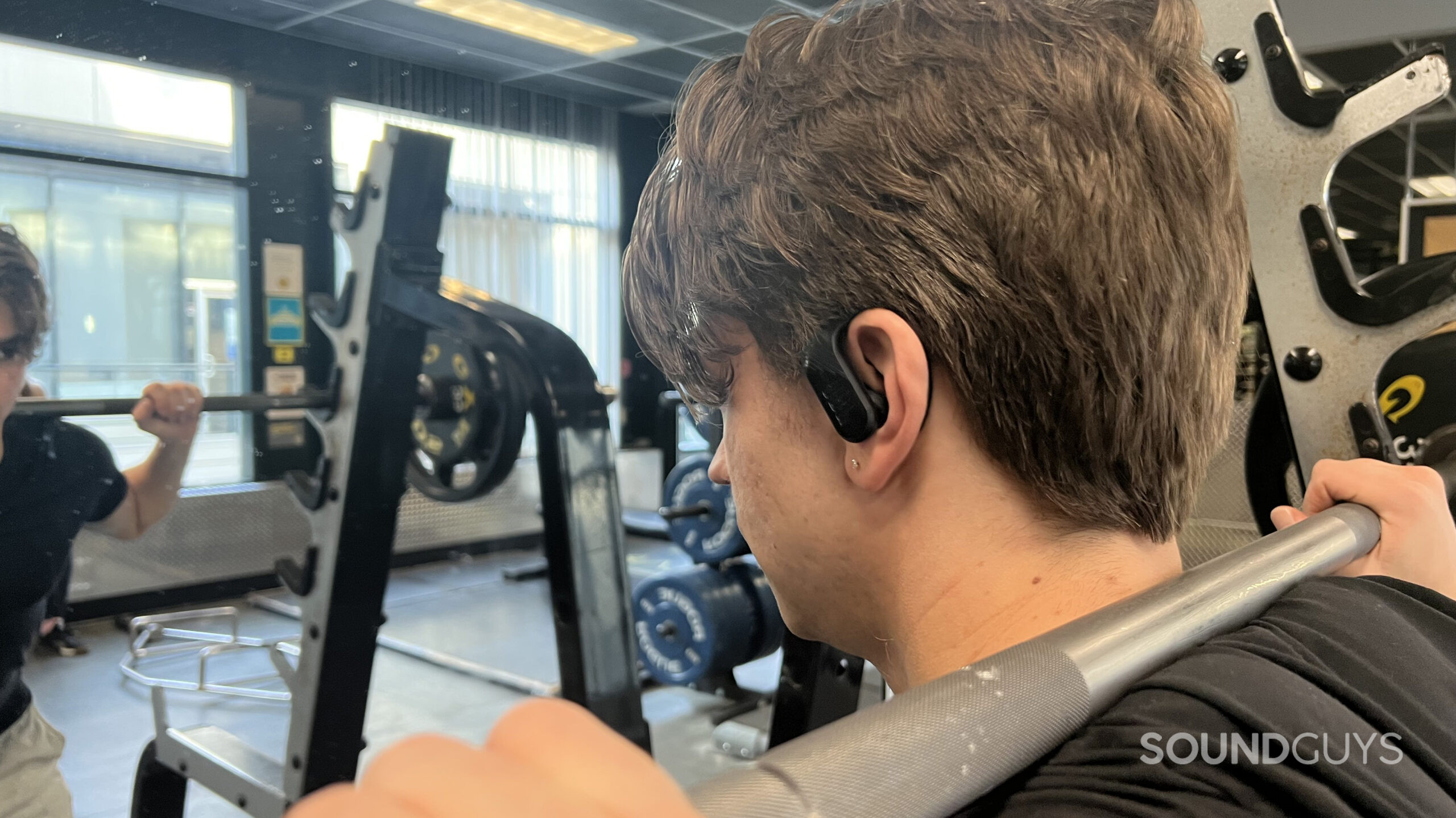 JBL Endurance Peak 3 on ear as they stand at a squat rack