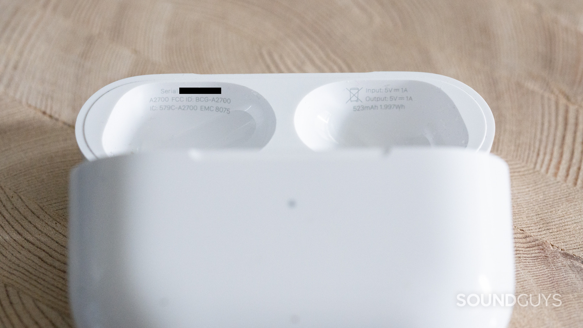 A photo of the AirPods Pro case with the serial number blacked out.