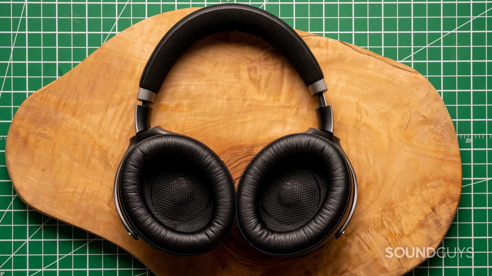 A photo of the Focal Bathys sitting atop a wood slab, with the ear cups facing the reader.