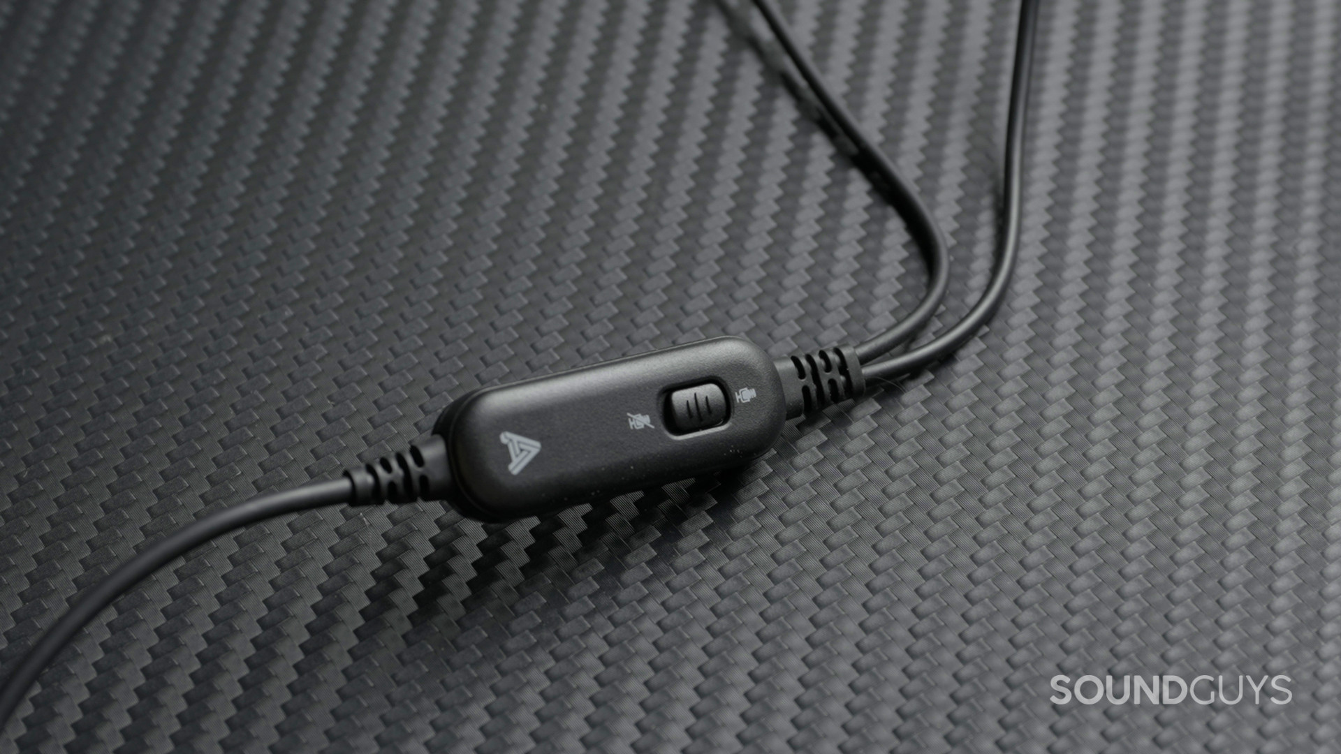 The Audeze LCD-GX has a physical mute switch on the cable.