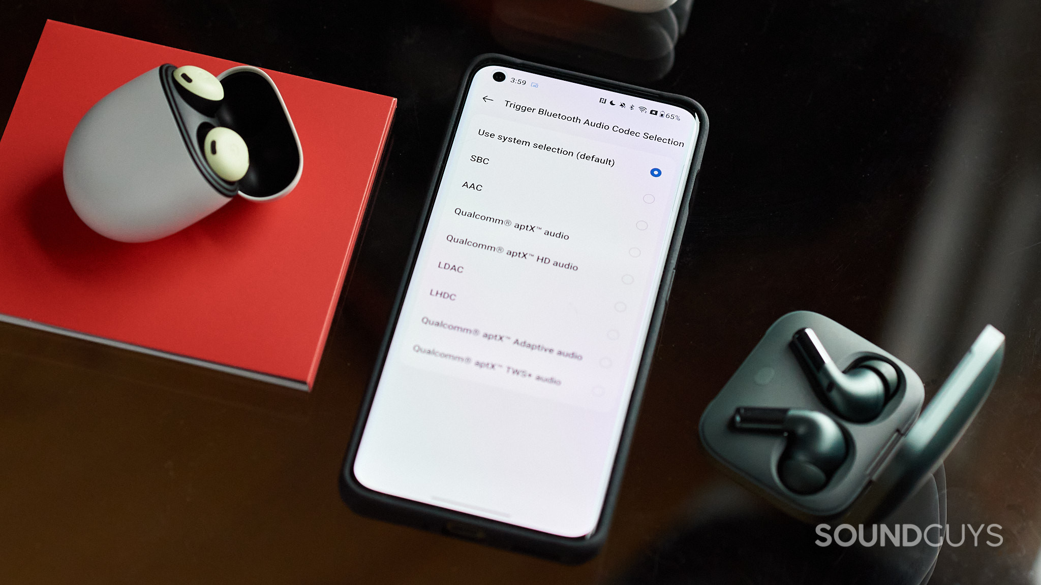 A phone displays Bluetooth codecs with the OnePlus Buds Pro 2 and Google Pixel Buds Pro.