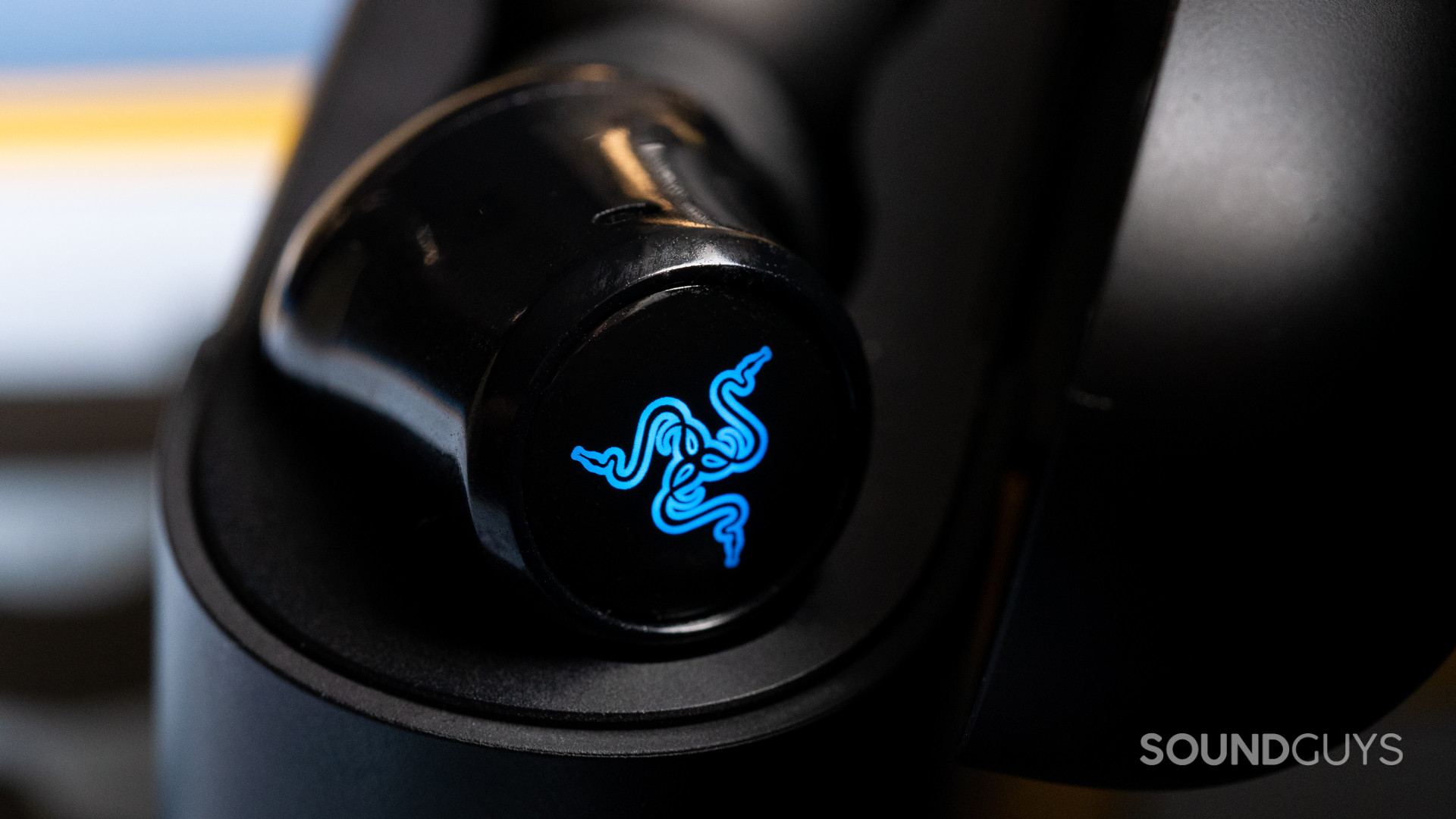 A photo of the RGB logo on the back of the Razer Hammerhead Pro Hyperspeed.