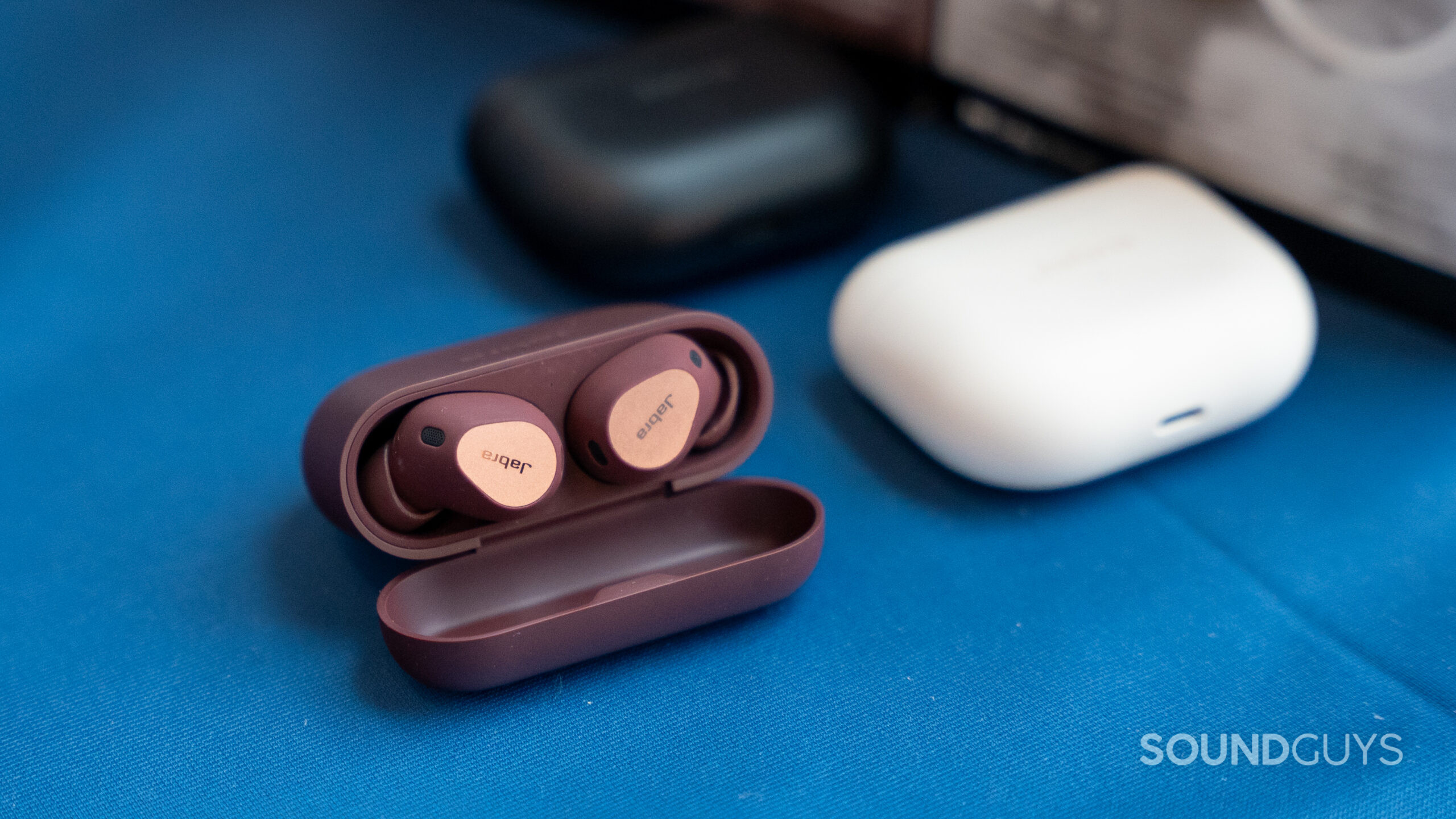 For comparison the Jabra Elite 10 sits next to AirPods.