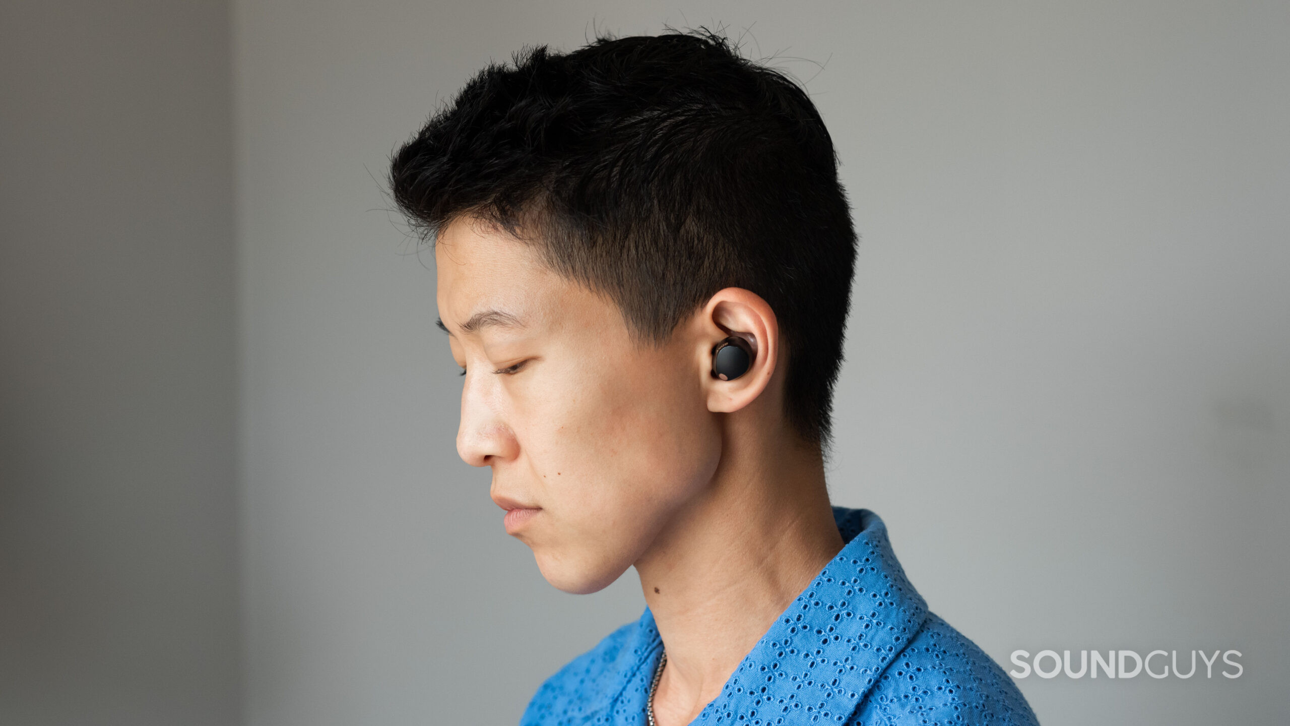 Sony WF-1000XM5 person wears-1 A person wears the Sony WF-1000XM5 earbuds.