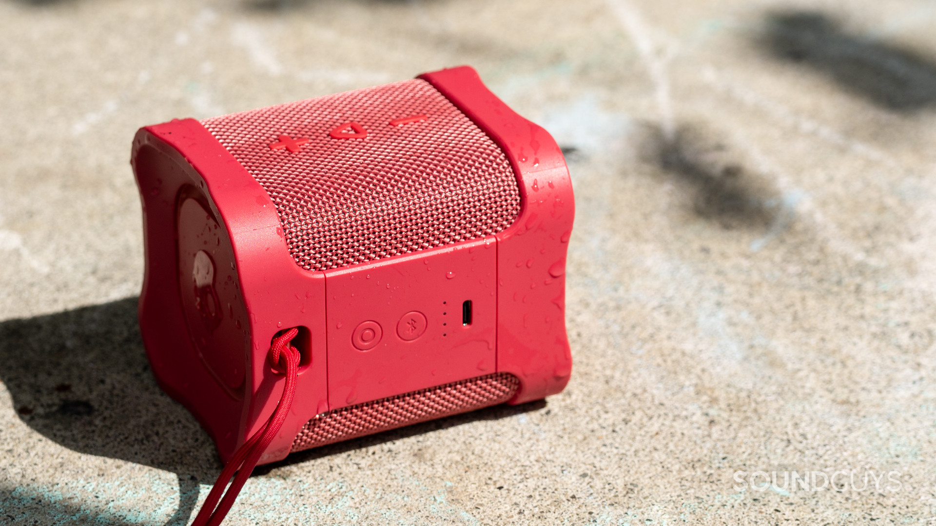 The Skullcandy Terrain Mini XT sits atop chalky concrete.