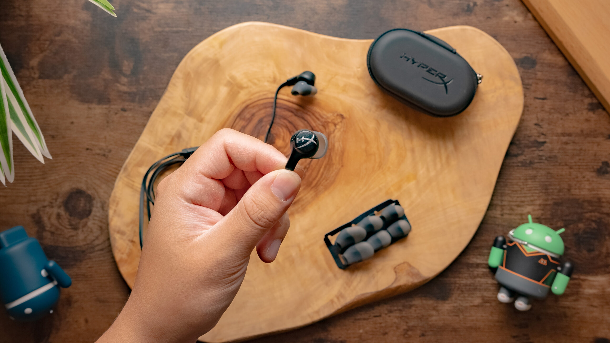 The HyperX Cloud Earbuds II with the HyperX logo being shown on the outside of the earbud shell.