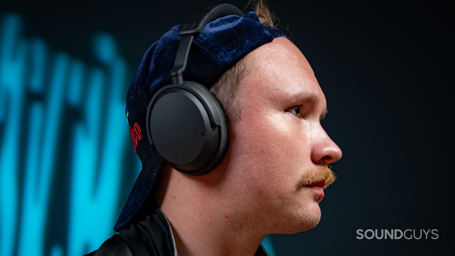 A man wearing the Sennheiser ACCENTUM Wireless headphones.