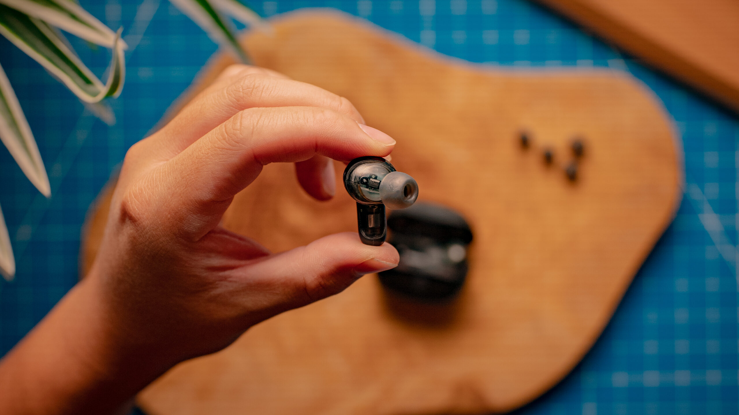Skullcandy-Rail-ANC-Earbuds-Image-#1 A hand holds one of the Skullcandy Rail ANC buds showing the inner housing.